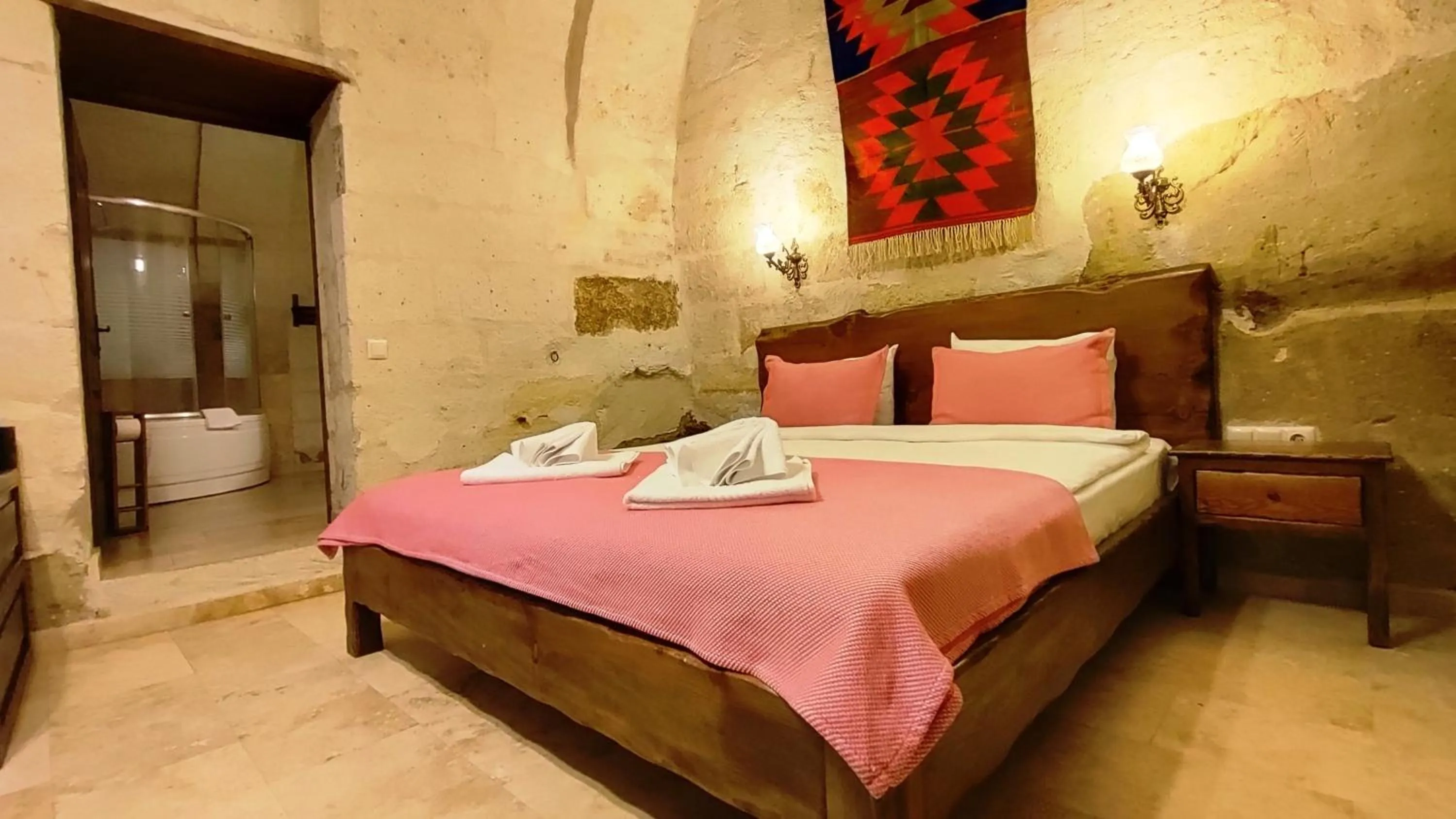 Bed in ARMEsos Cave Hotel