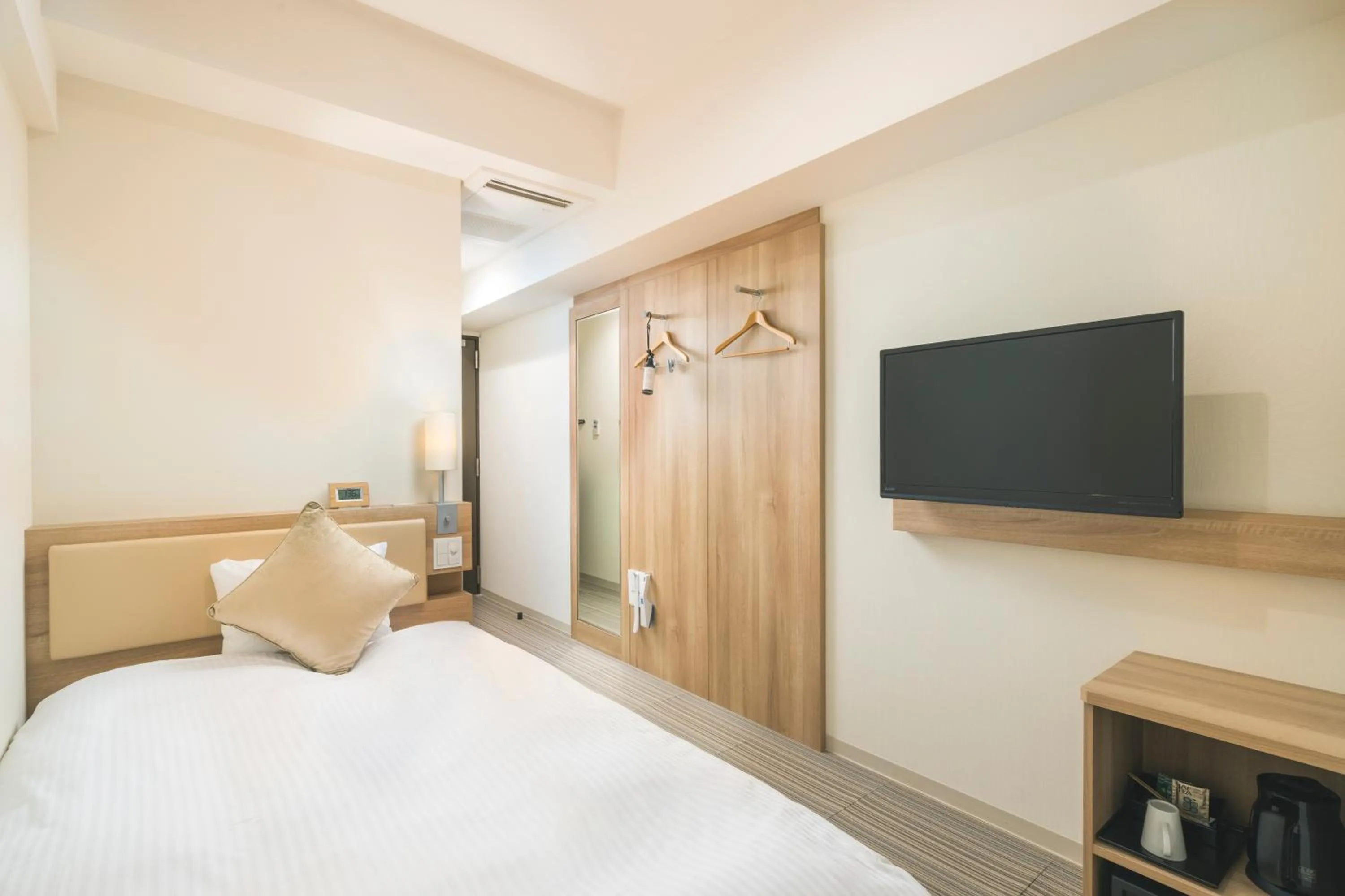 Photo of the whole room, Bed in KOKO HOTEL Hiroshima Ekimae