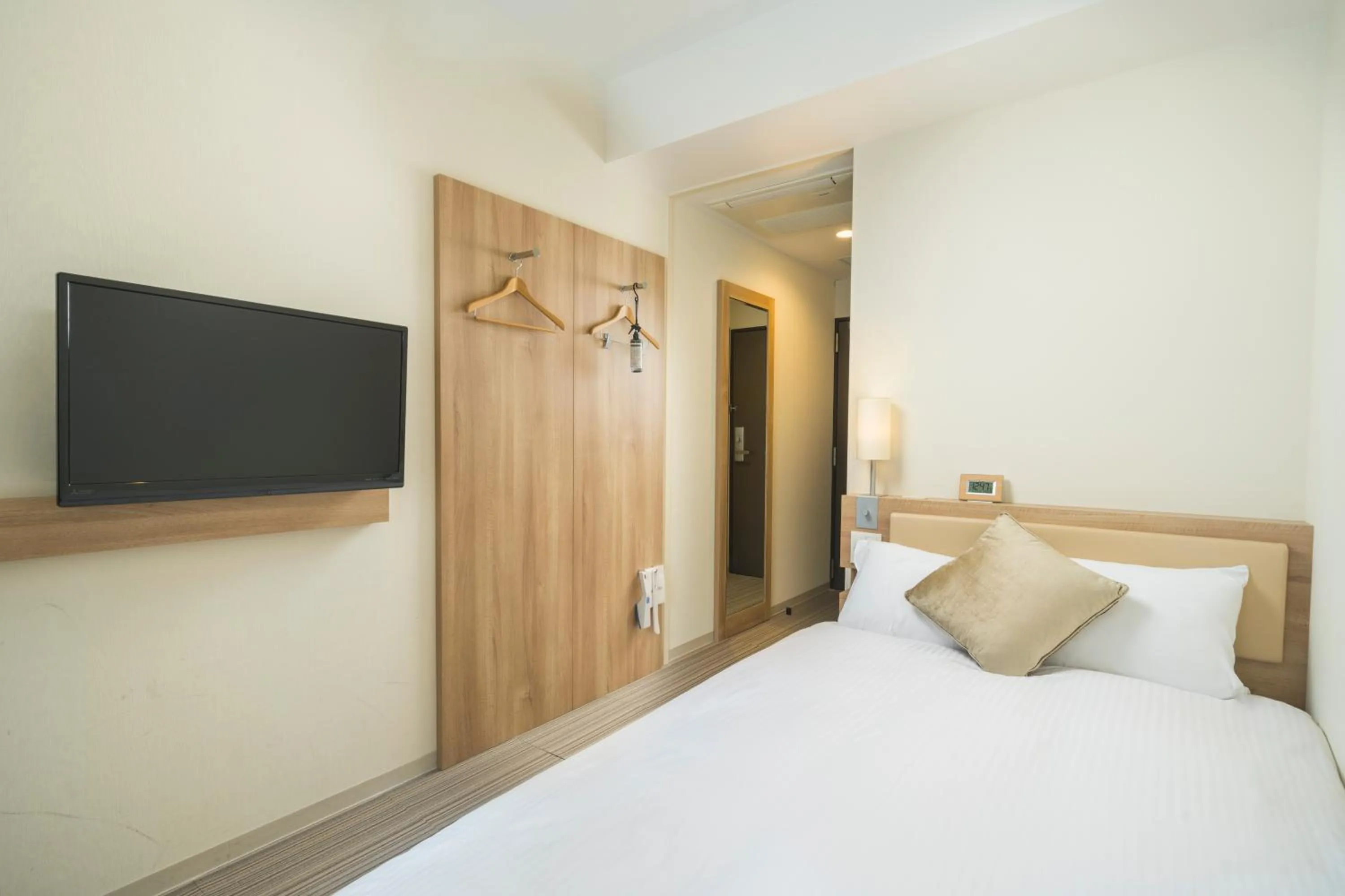 Photo of the whole room, Bed in KOKO HOTEL Hiroshima Ekimae