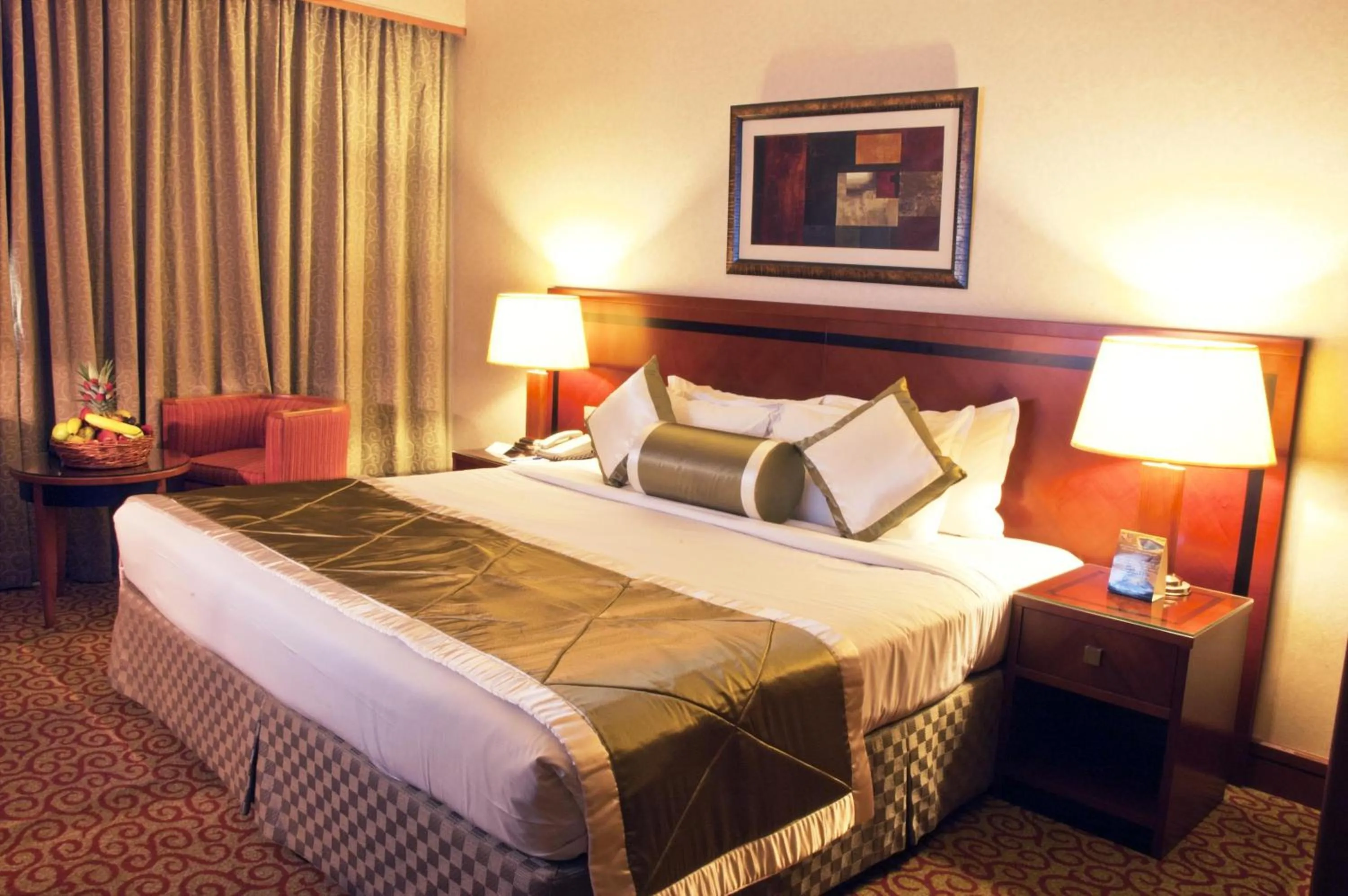 Bed in Ramee Royal Hotel