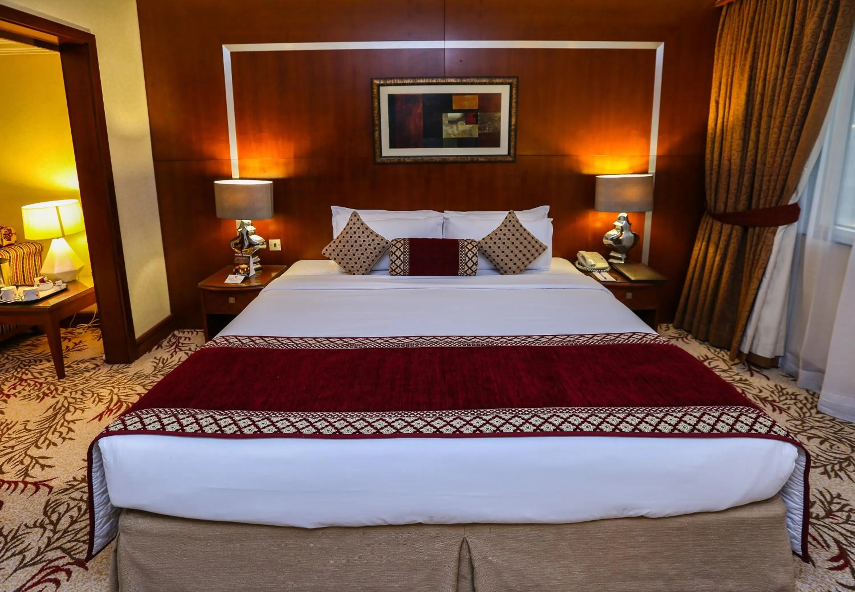Bed in Ramee Royal Hotel