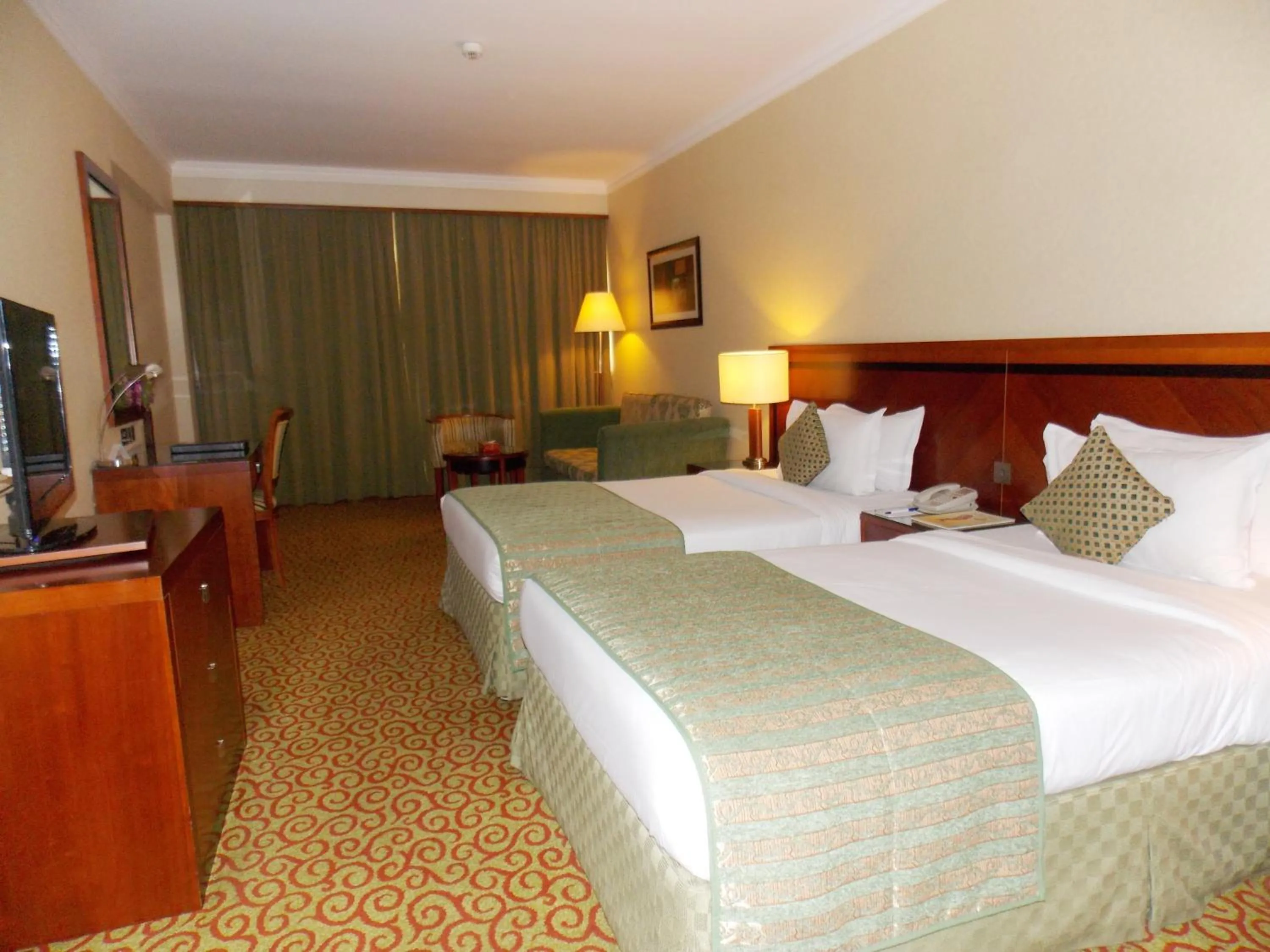 Photo of the whole room, Bed in Ramee Royal Hotel