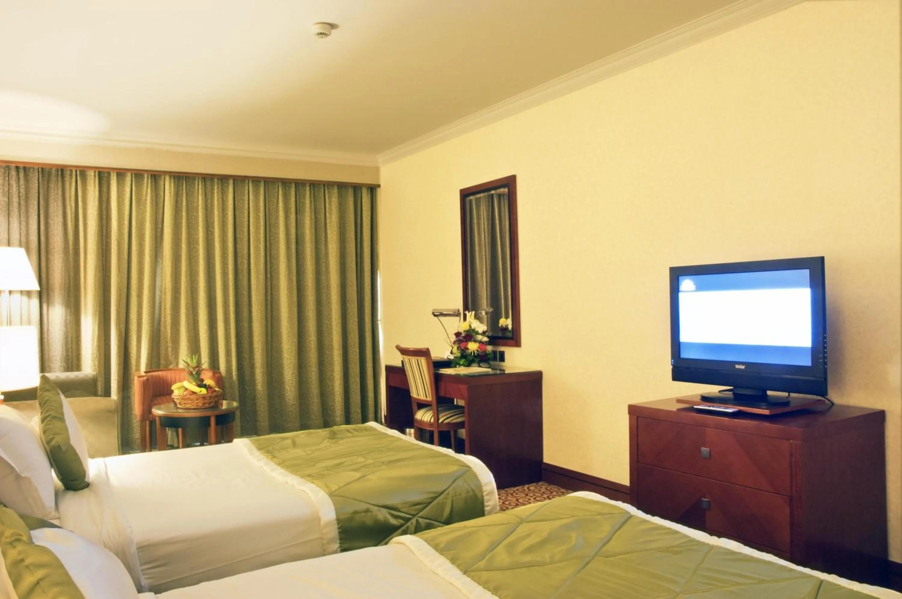 Photo of the whole room, Bed in Ramee Royal Hotel