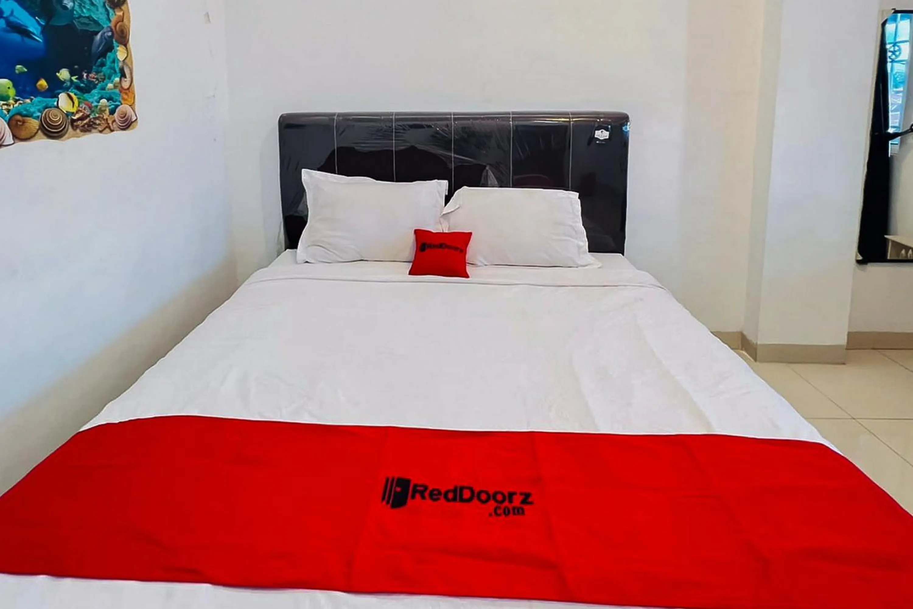 Bed in RedDoorz At Damai Guest House Kabanjahe