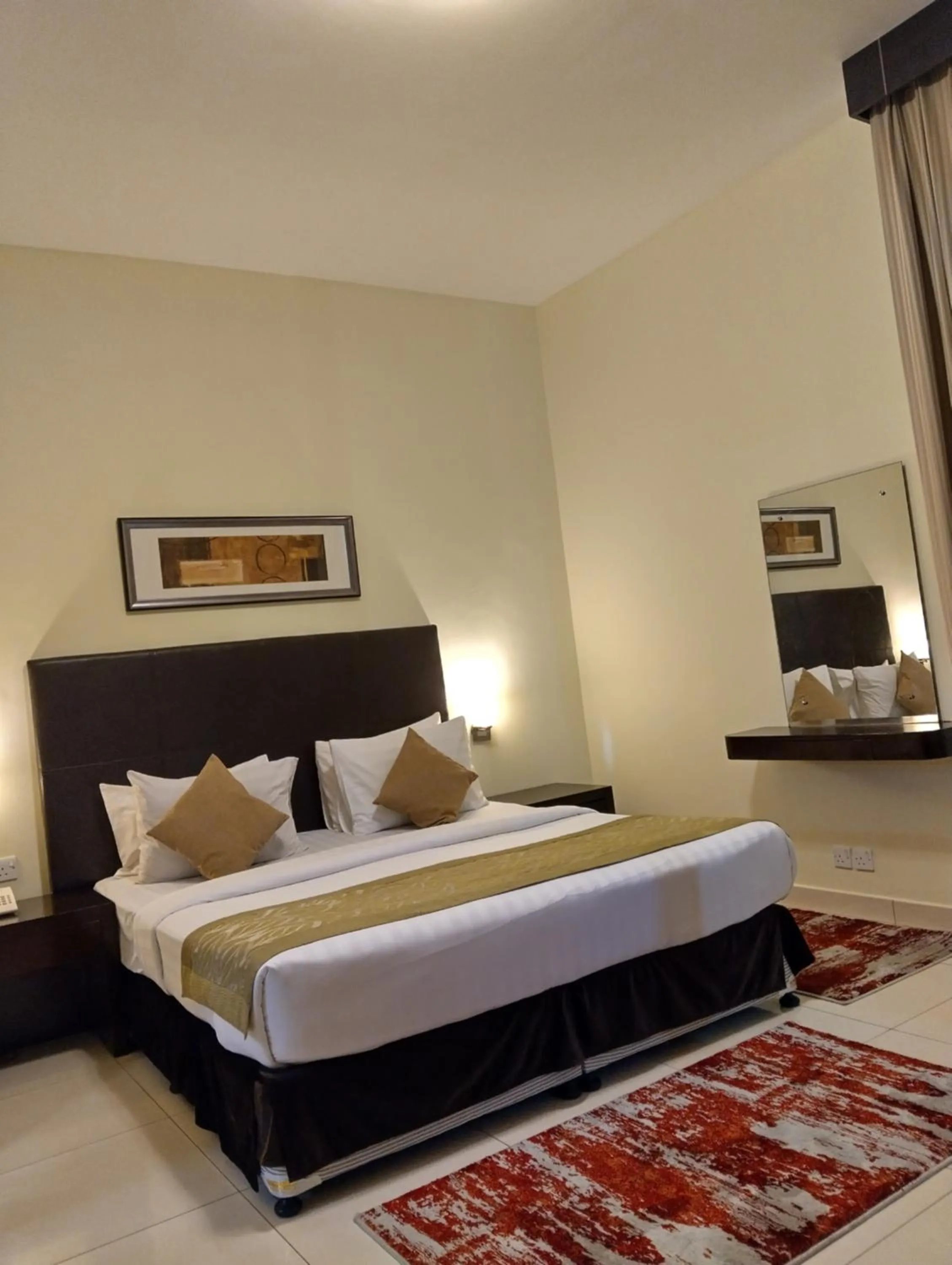 Bed in Tulip Creek Hotel Apartments