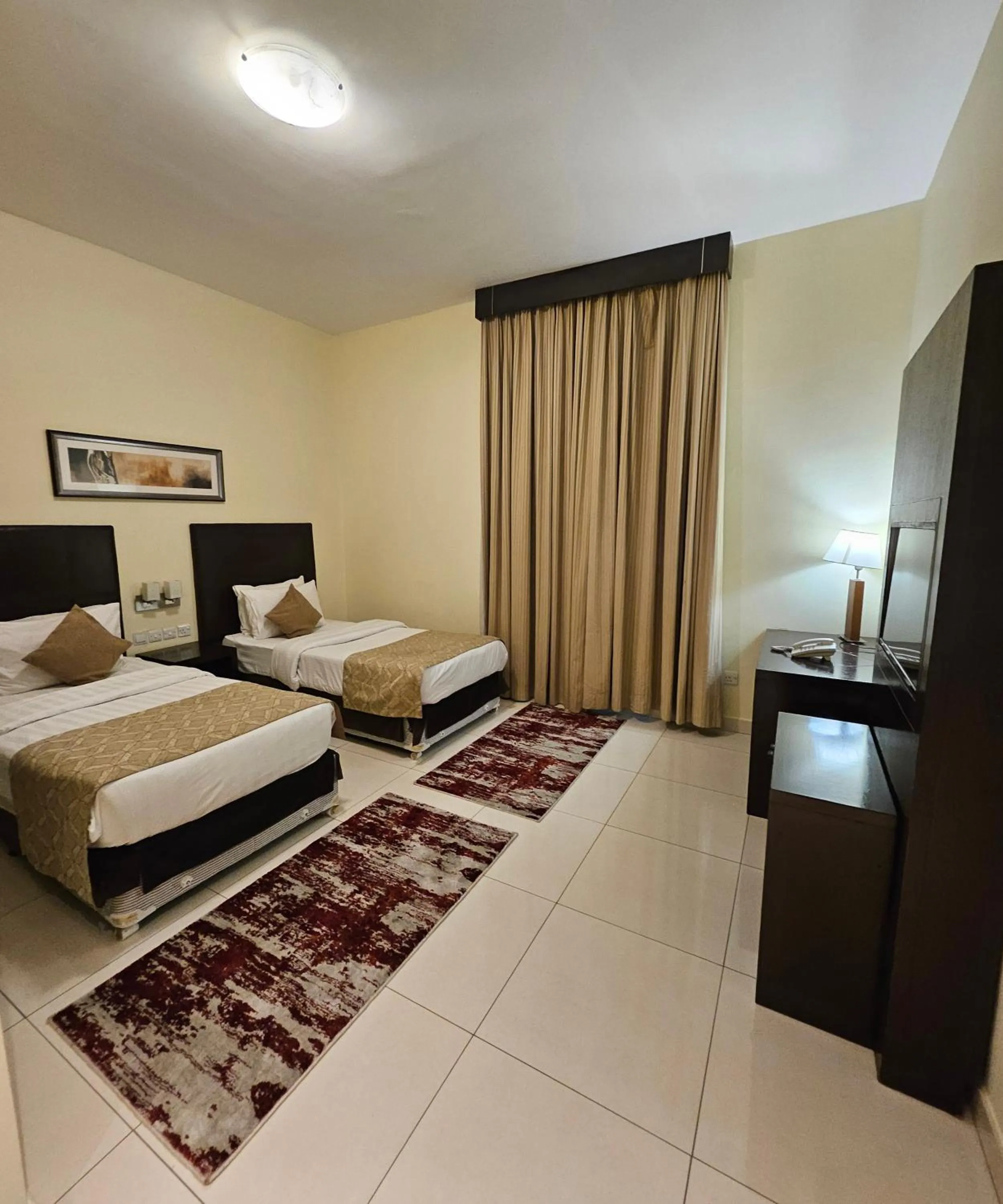 Bed in Tulip Creek Hotel Apartments