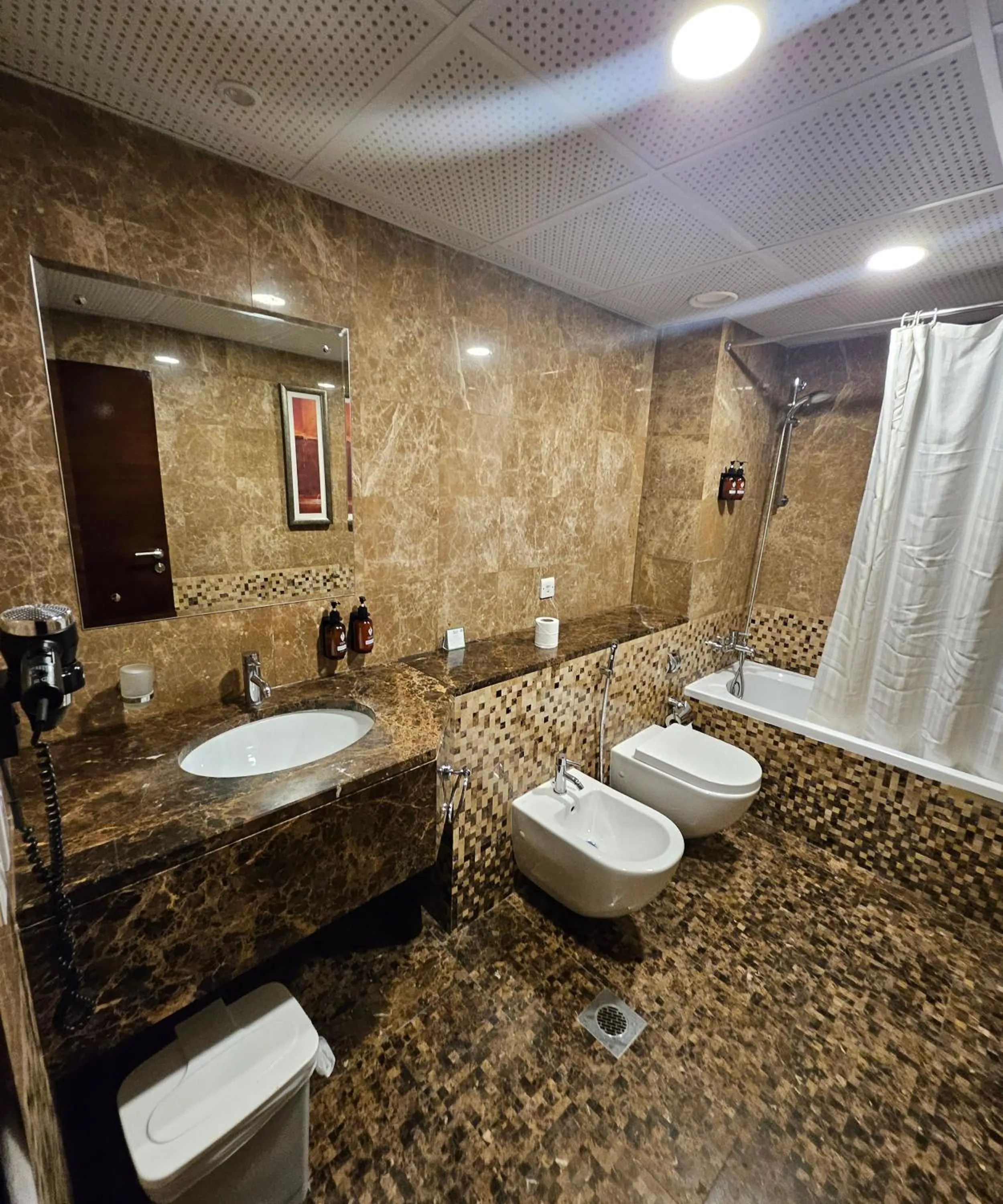 Shower in Tulip Creek Hotel Apartments