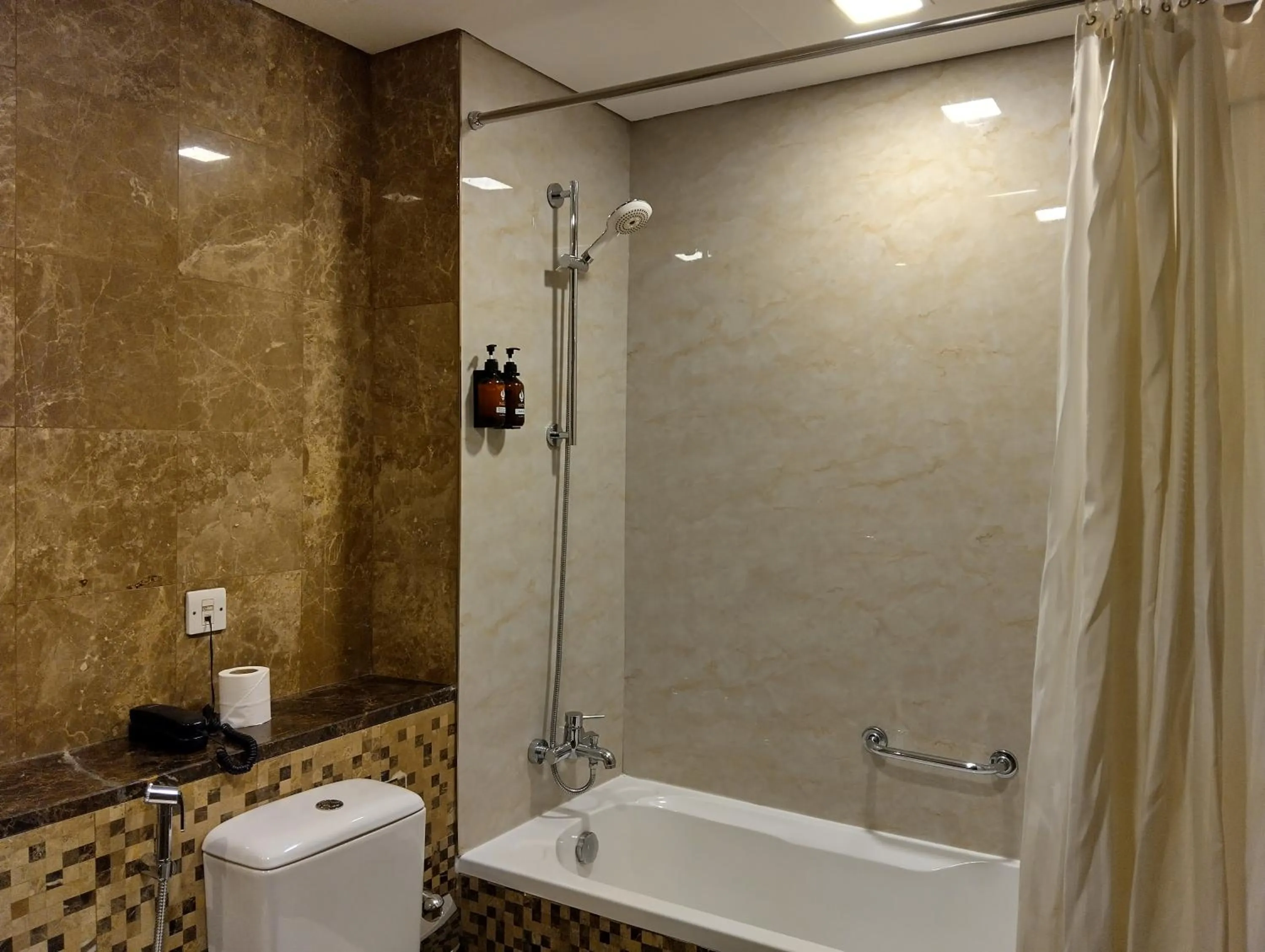 Shower in Tulip Creek Hotel Apartments