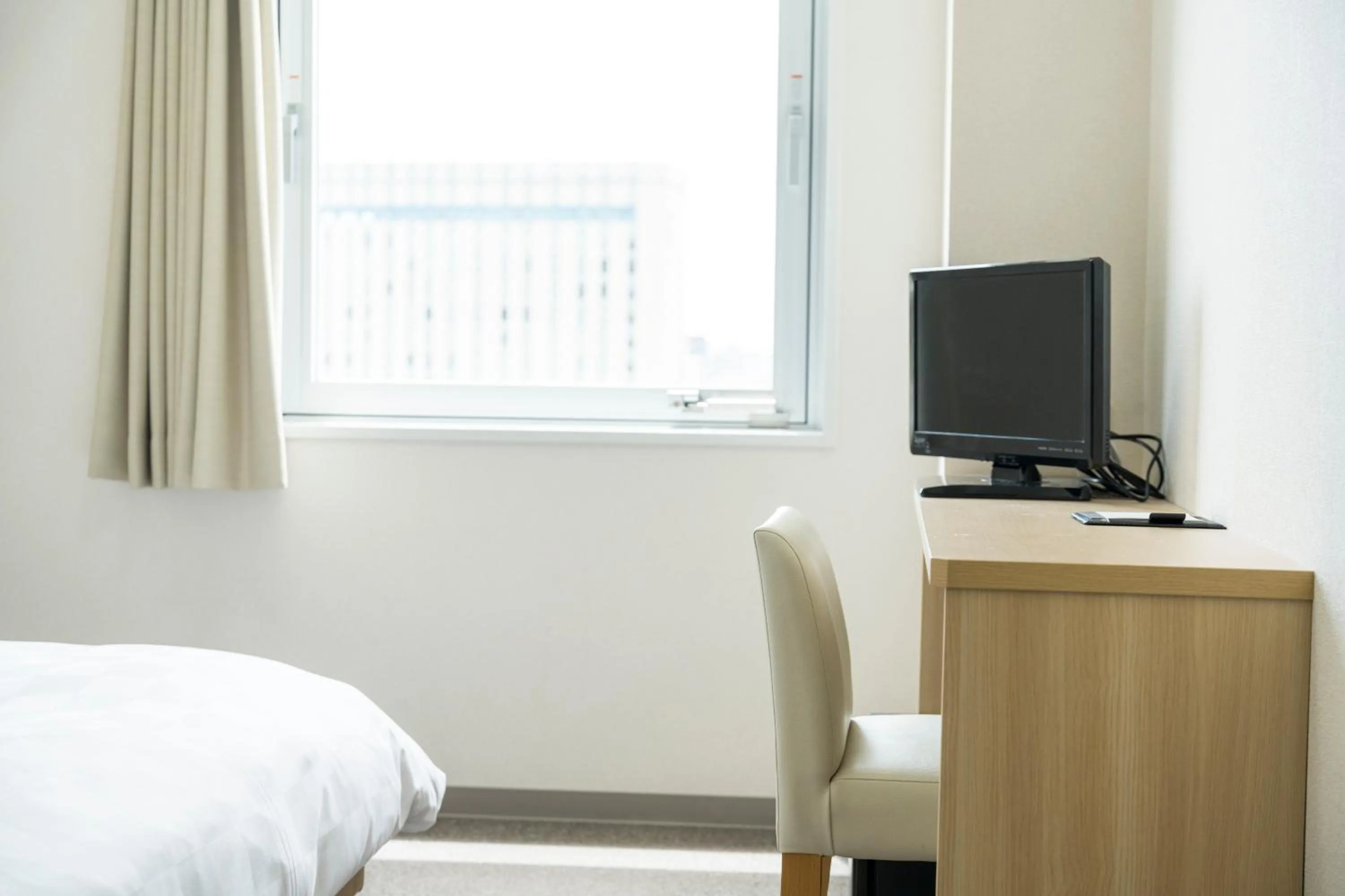 Photo of the whole room, Bed in KOKO HOTEL Kagoshima Tenmonkan