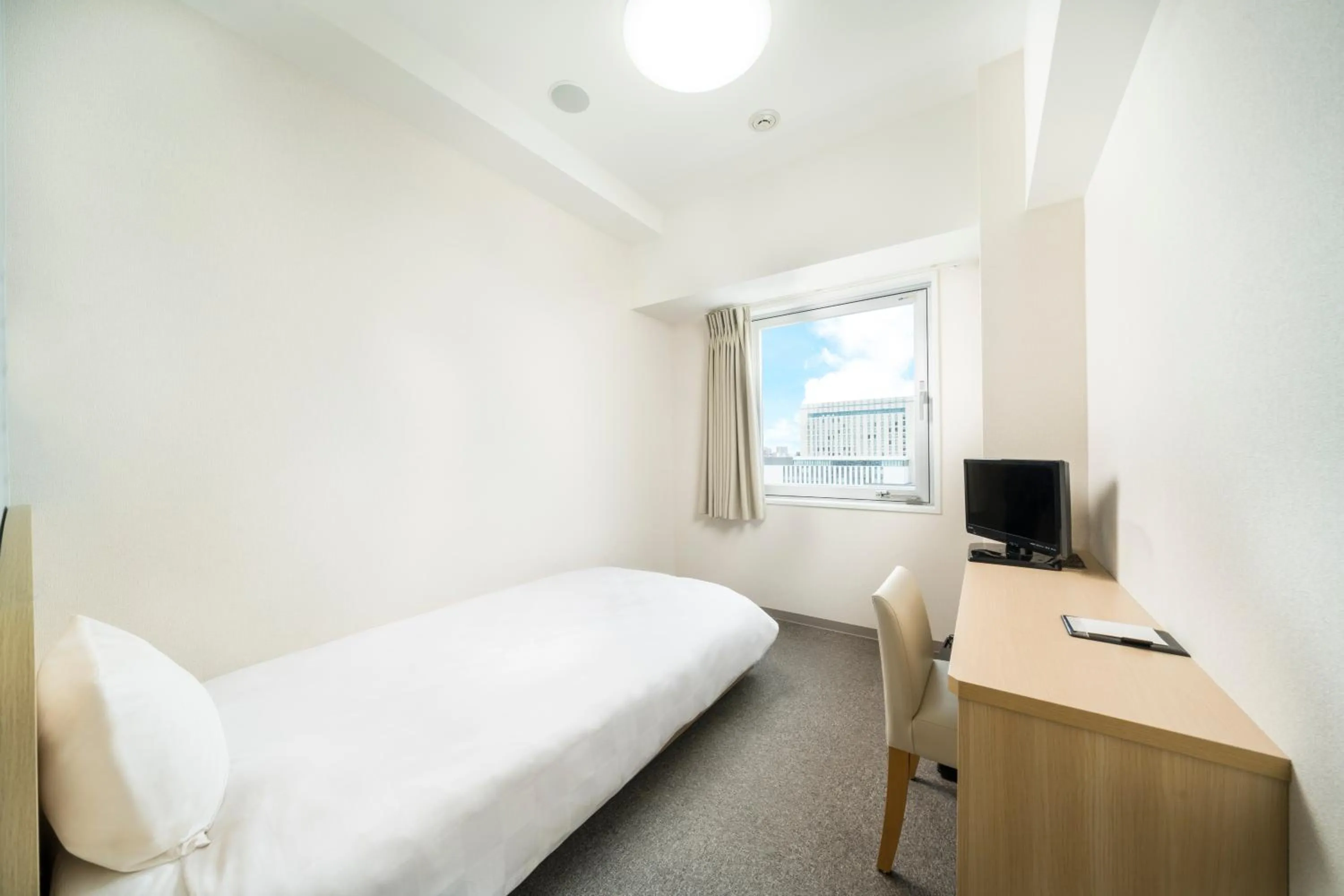 Photo of the whole room, Bed in KOKO HOTEL Kagoshima Tenmonkan