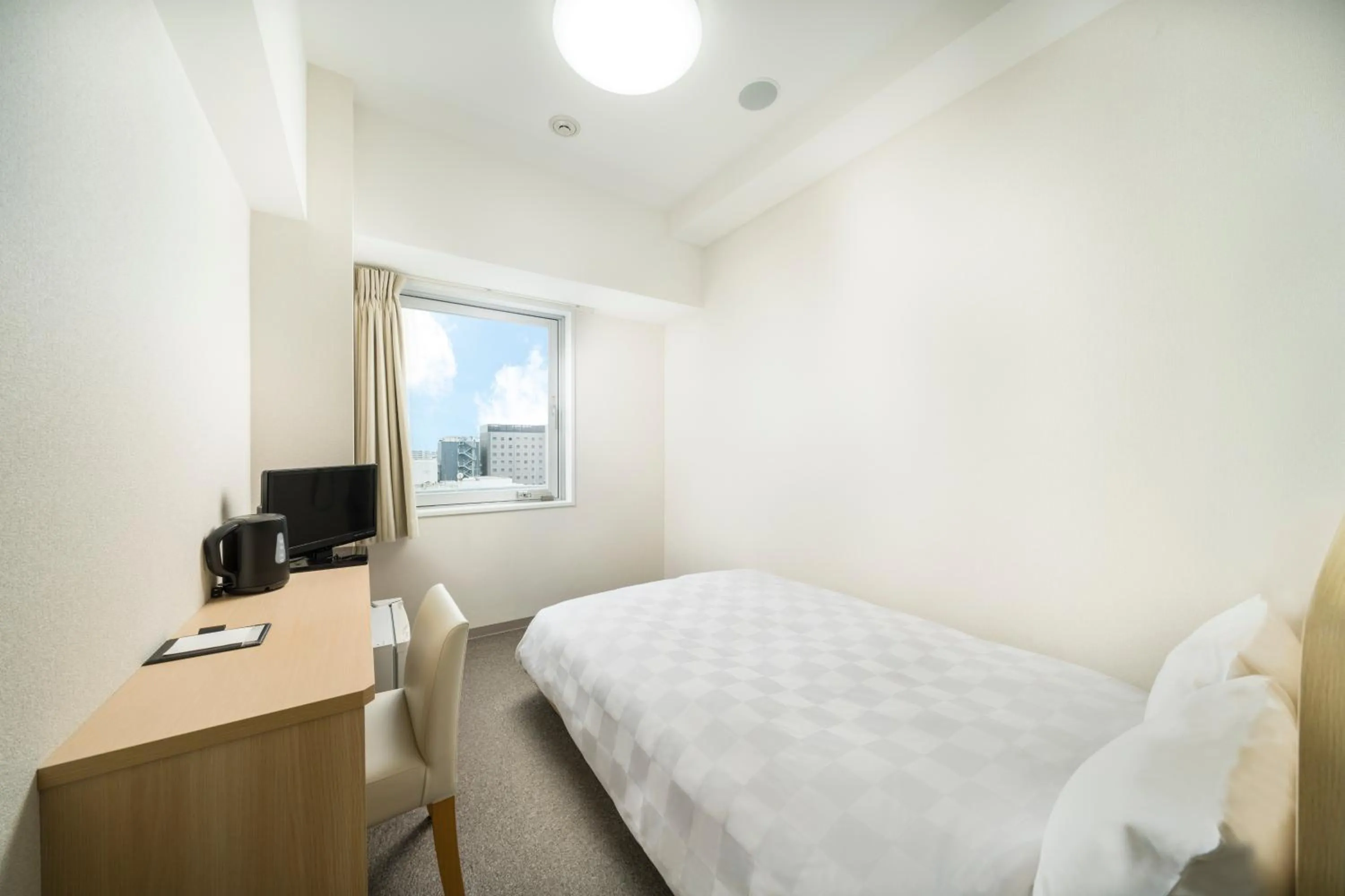 Photo of the whole room, Bed in KOKO HOTEL Kagoshima Tenmonkan