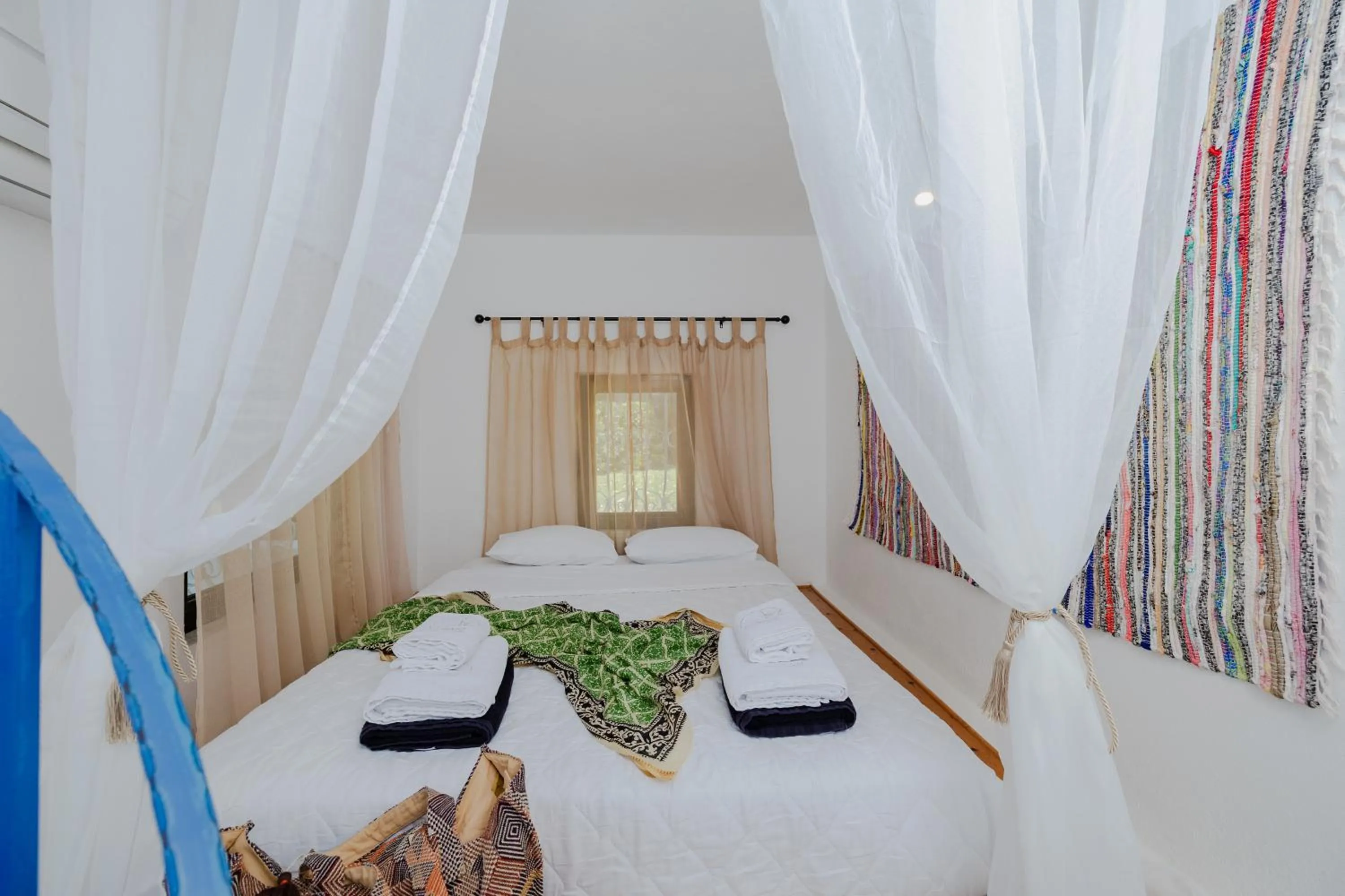 Bed in Eco Beach And Magic Garden Hotel