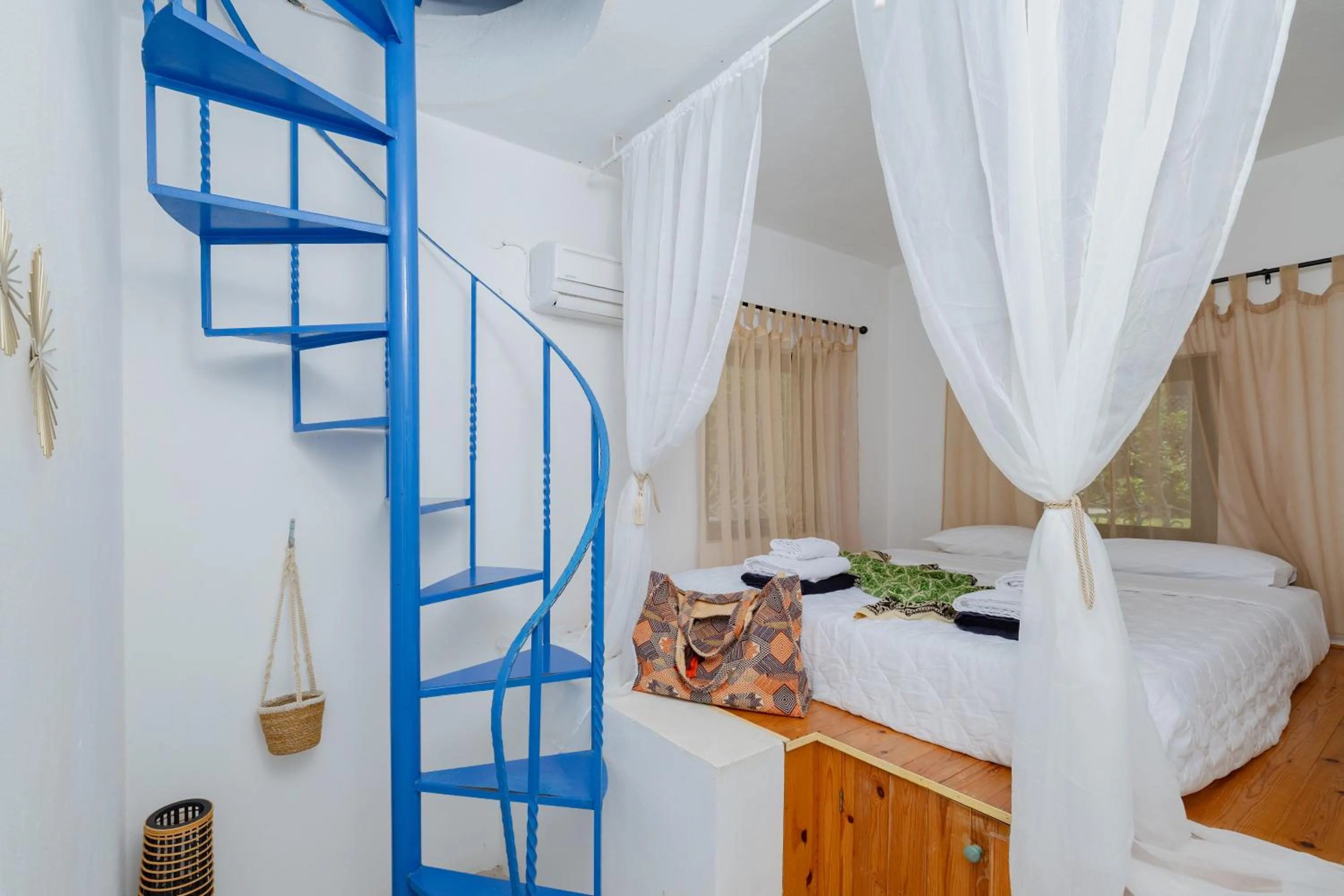 Bed in Eco Beach And Magic Garden Hotel