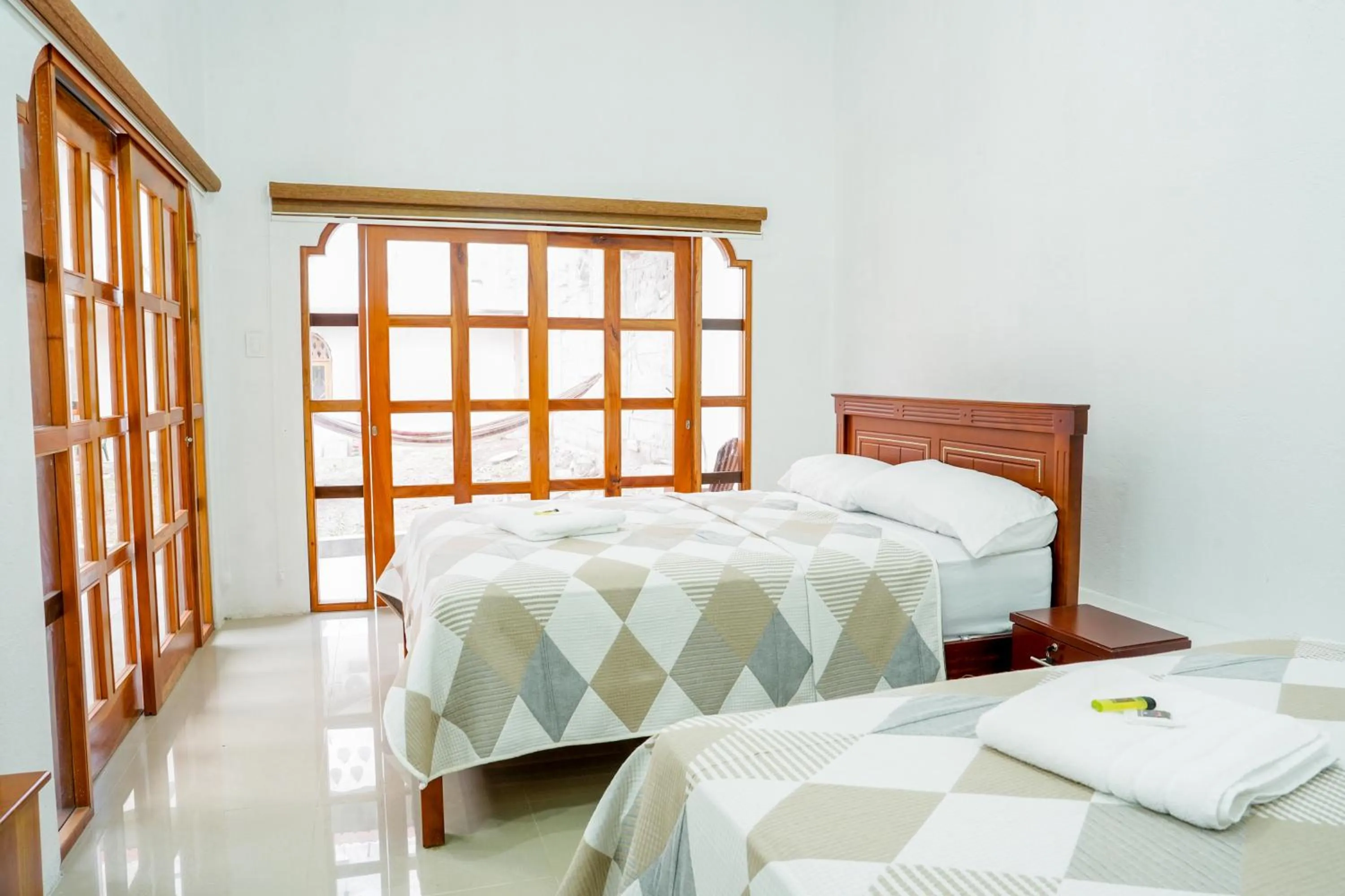 Bed in Royal Galápagos Inn