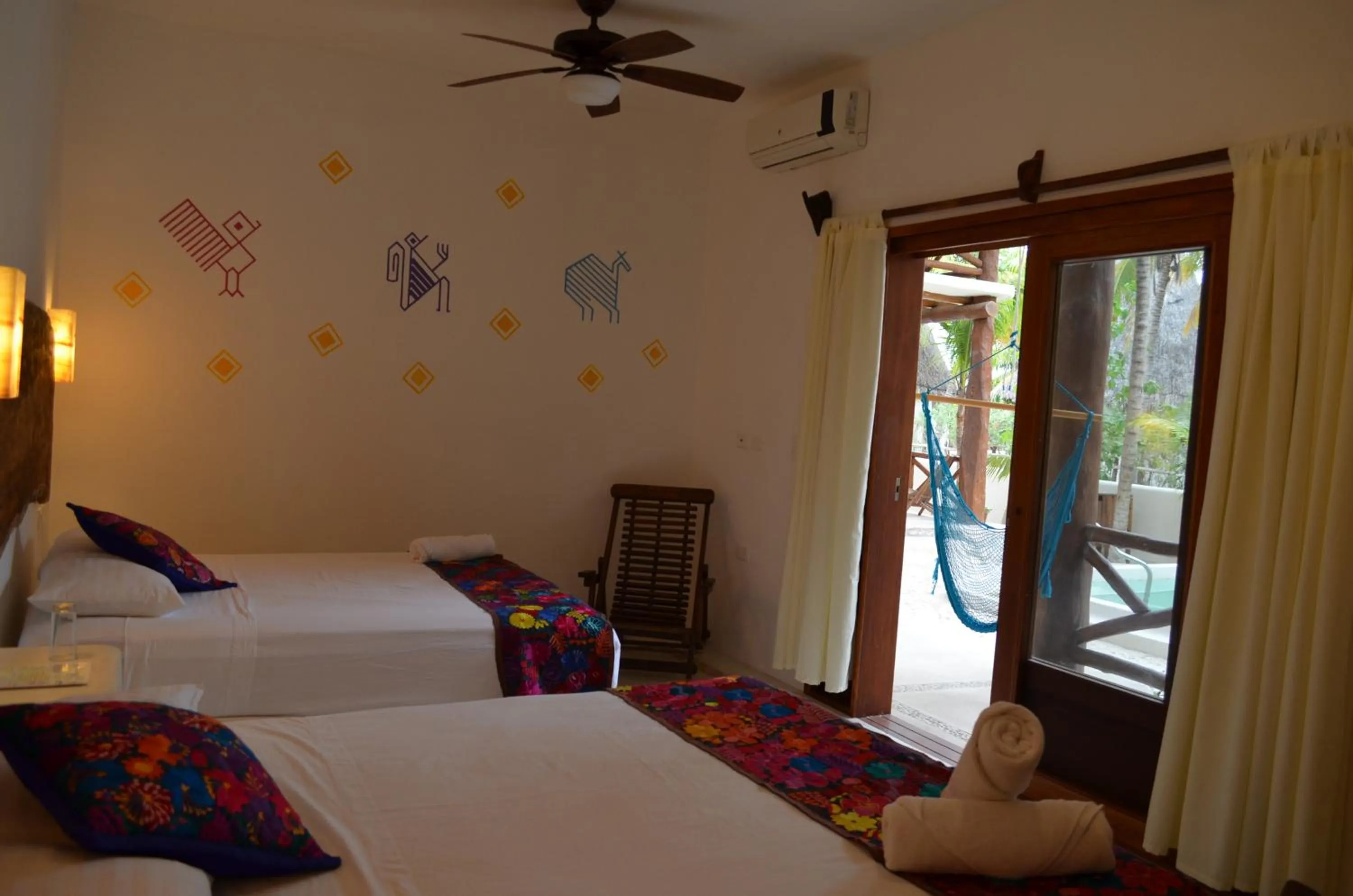 Bedroom, Bed in Casa Iguana Holbox - Beachfront Hotel