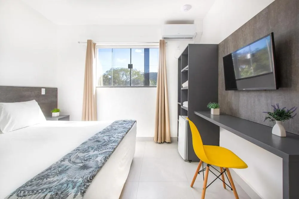 Bed in Hotel Cajueiro Guarujá