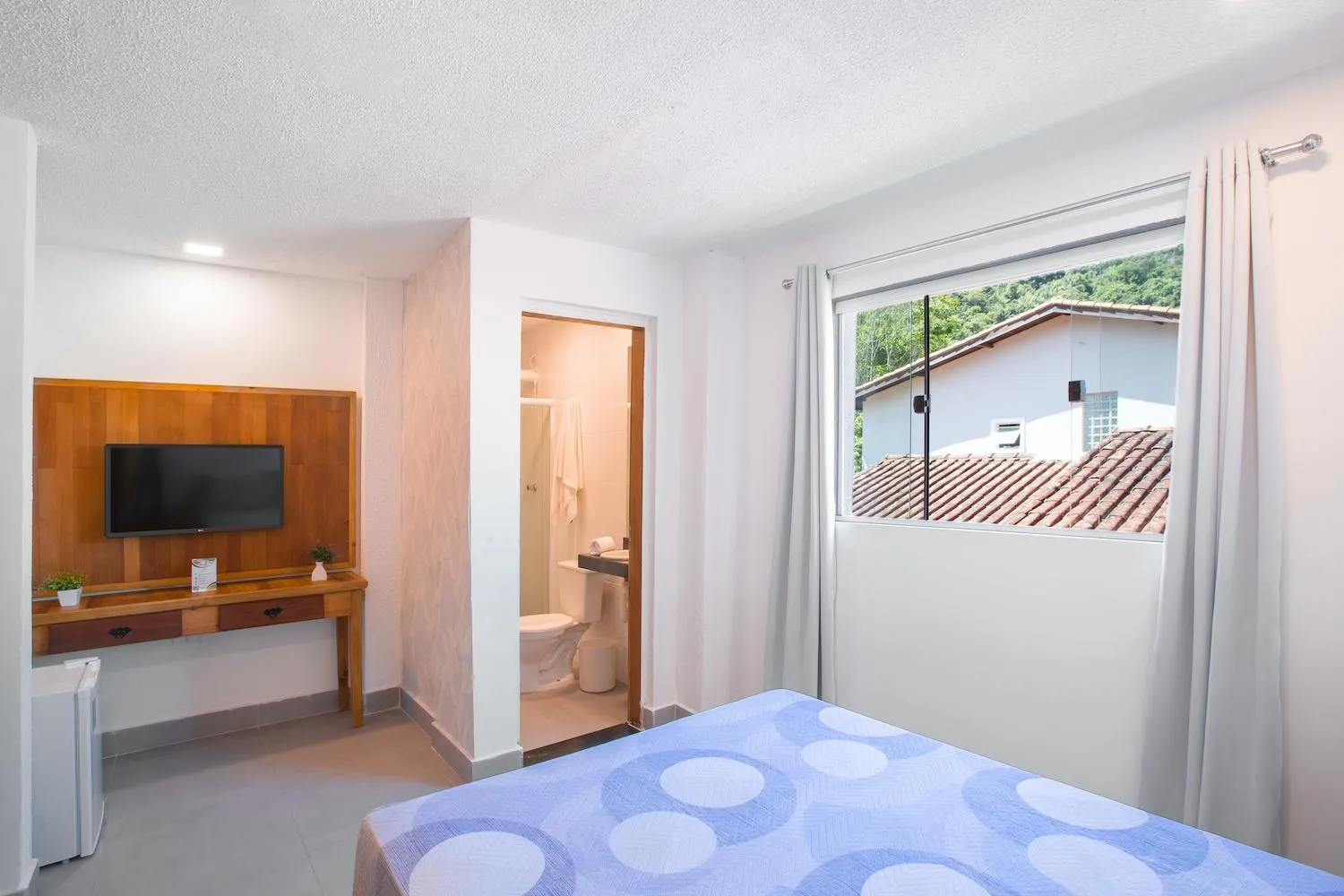 Bed in Hotel Cajueiro Guarujá