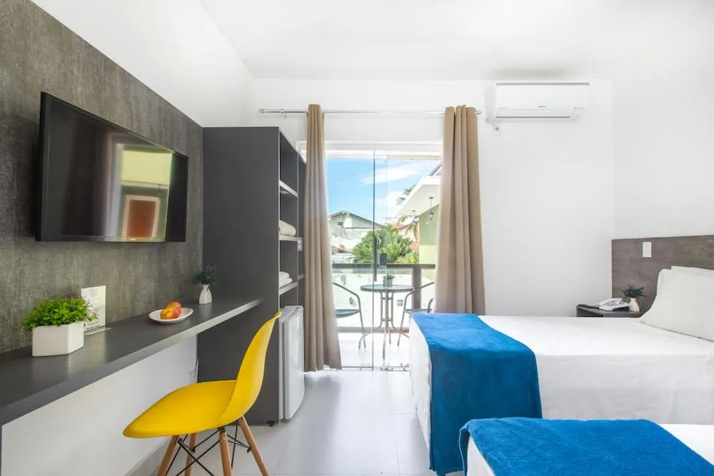 Bed in Hotel Cajueiro Guarujá