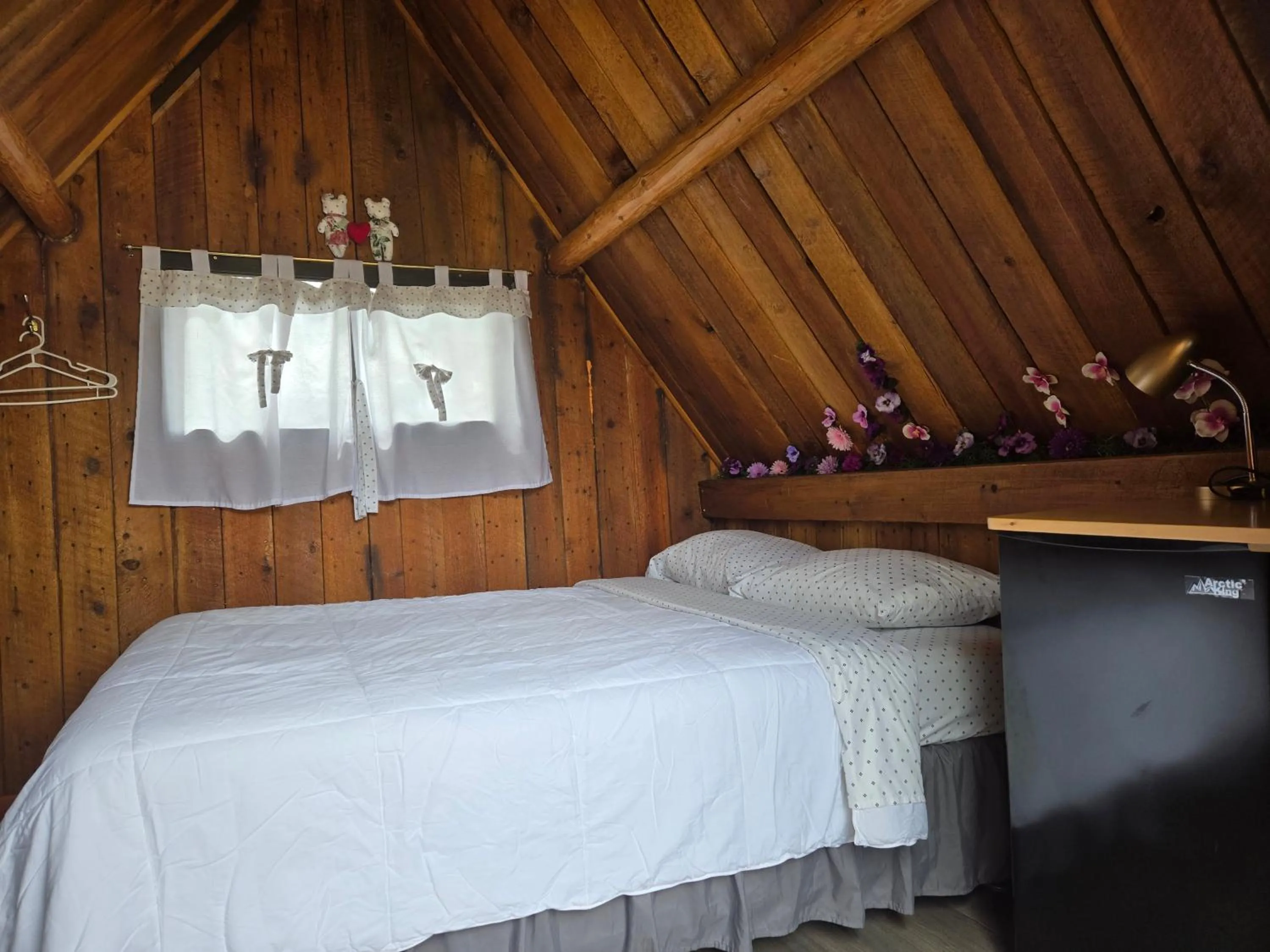 Bed in Blue River Campgrounds & Cabin-public washroom