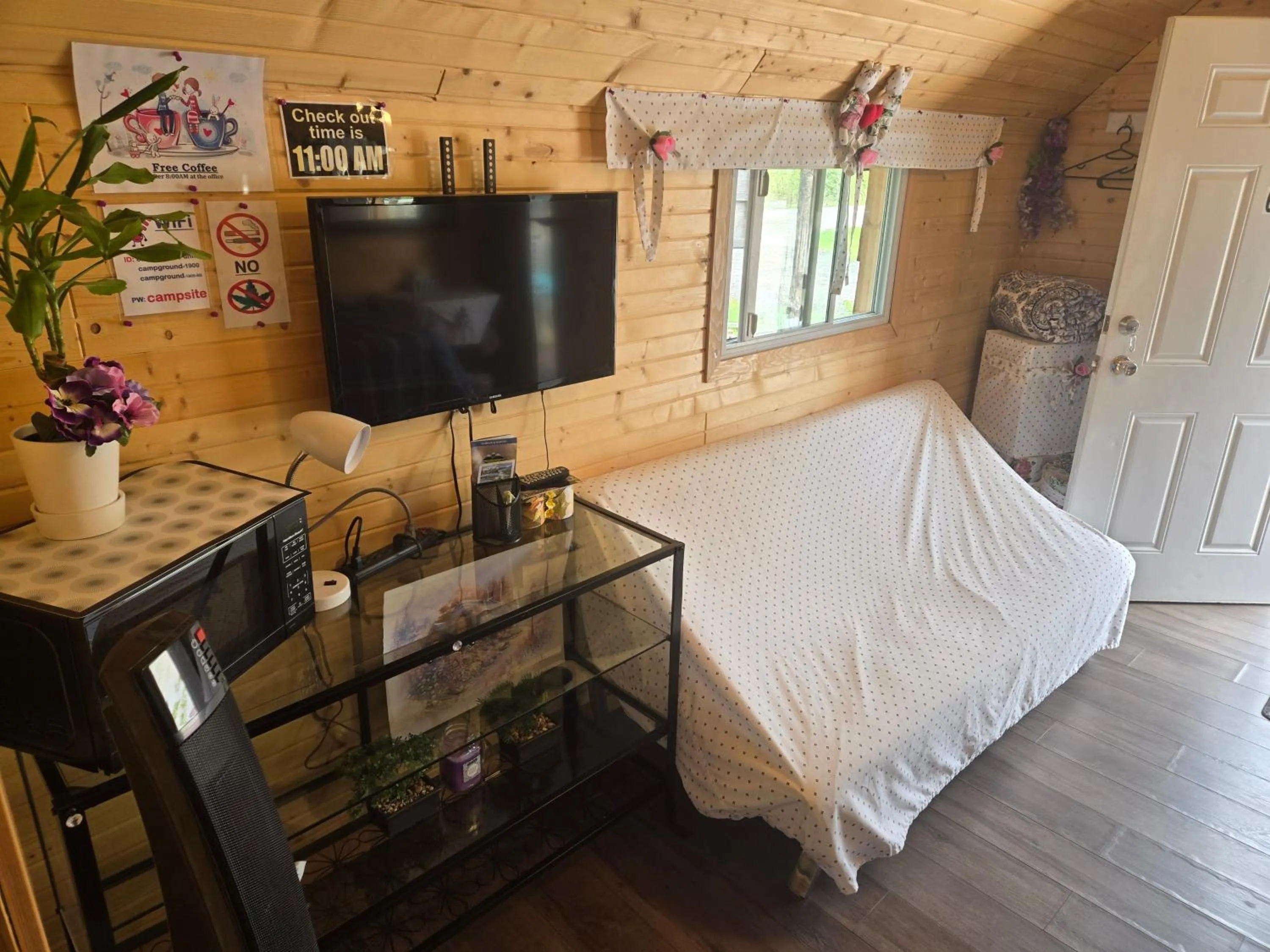 Bed in Blue River Campgrounds & Cabin-public washroom