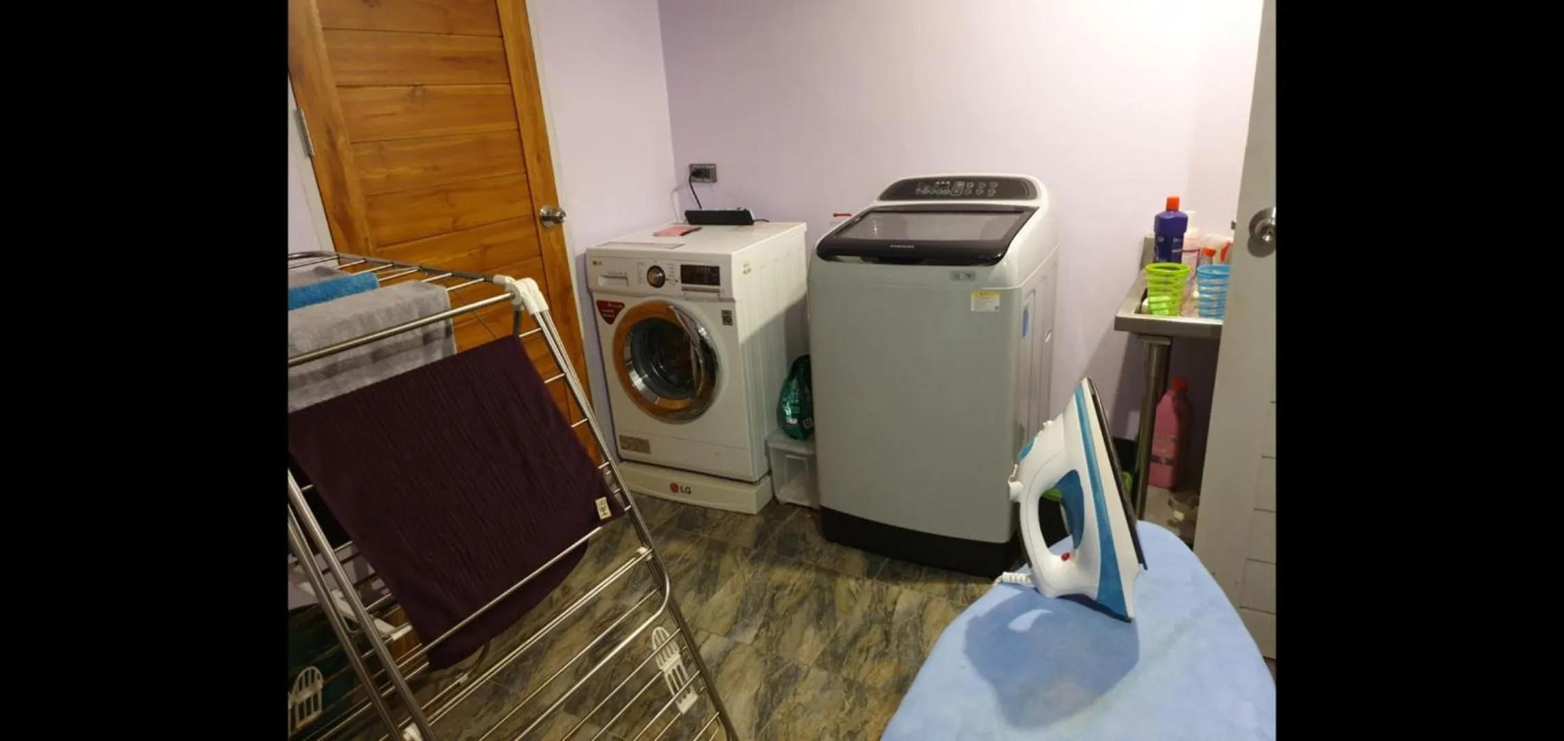 washing machine in Penthouse Crystal Bay Apartments