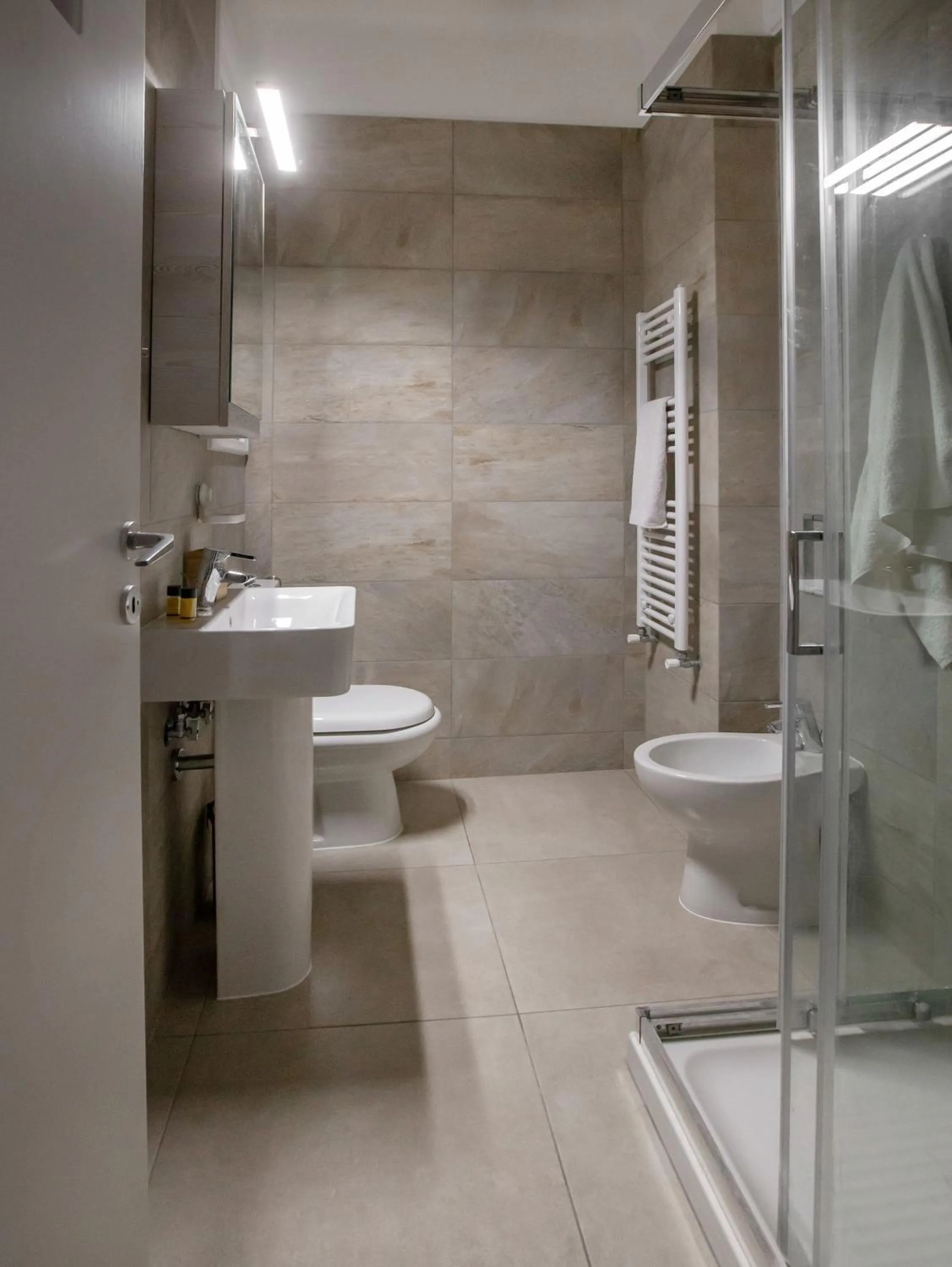 Bathroom in Isora Apartment by GHH