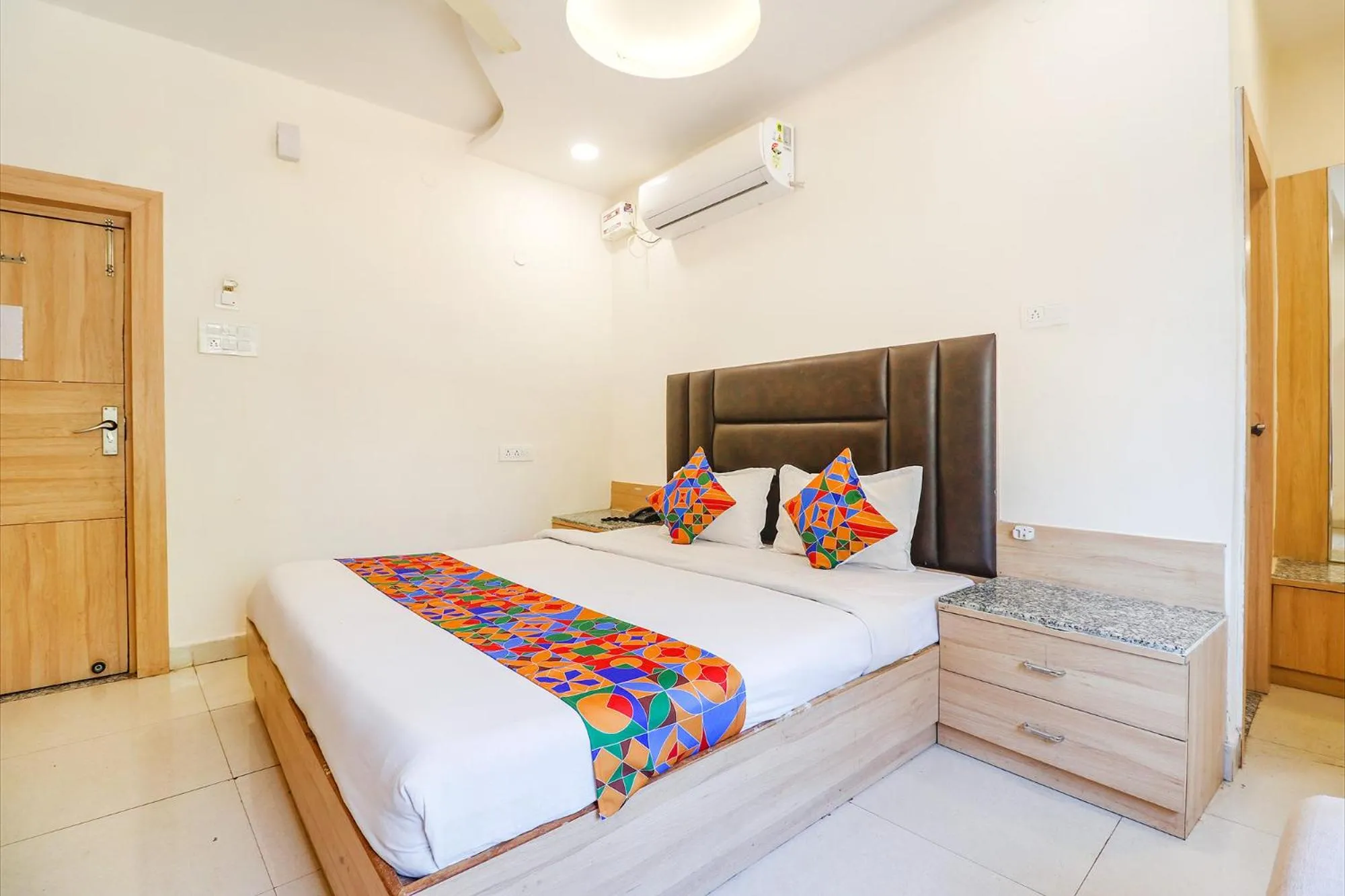 Bed in FabHotel Royal Aanandam