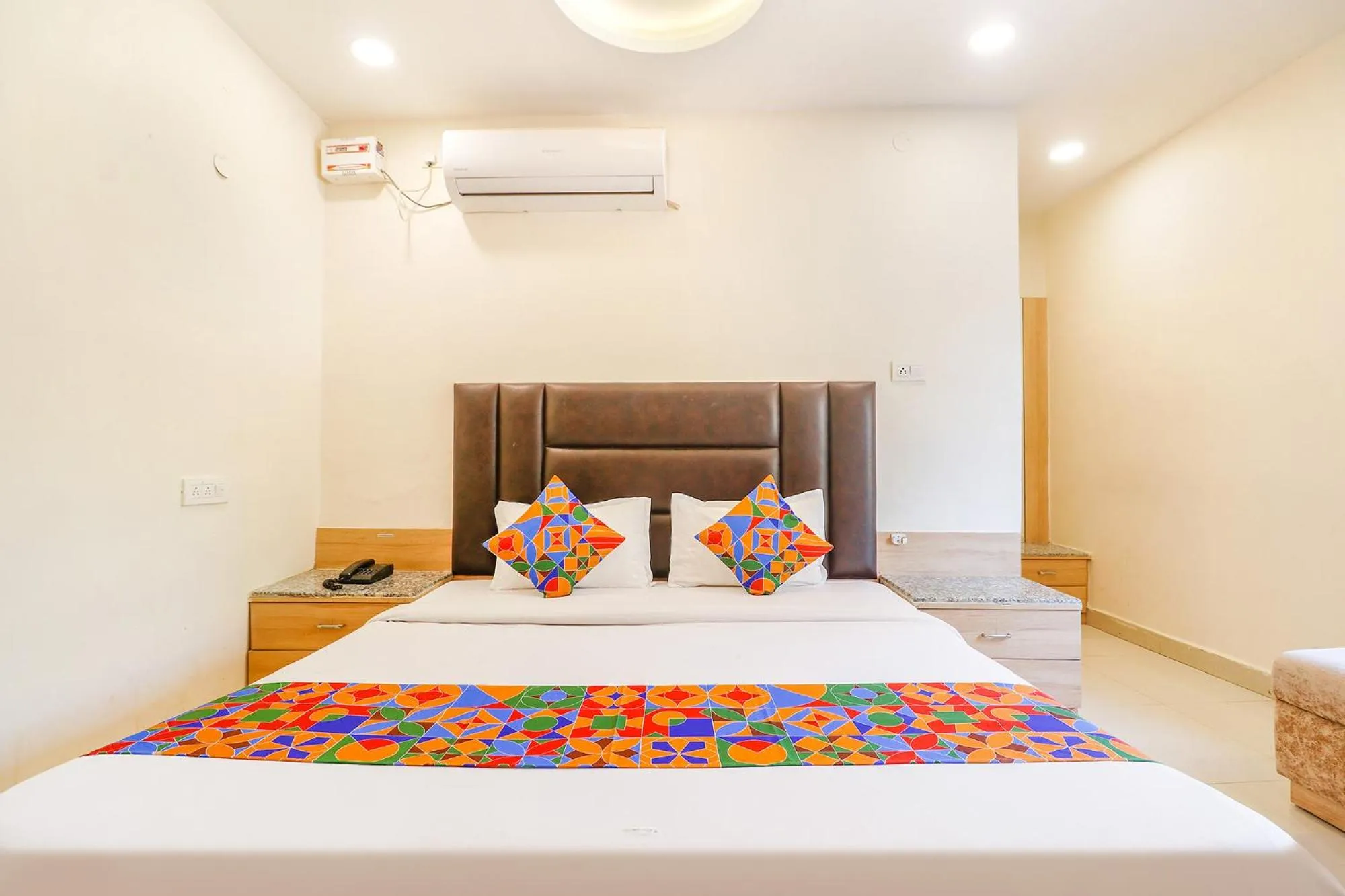 Bed in FabHotel Royal Aanandam