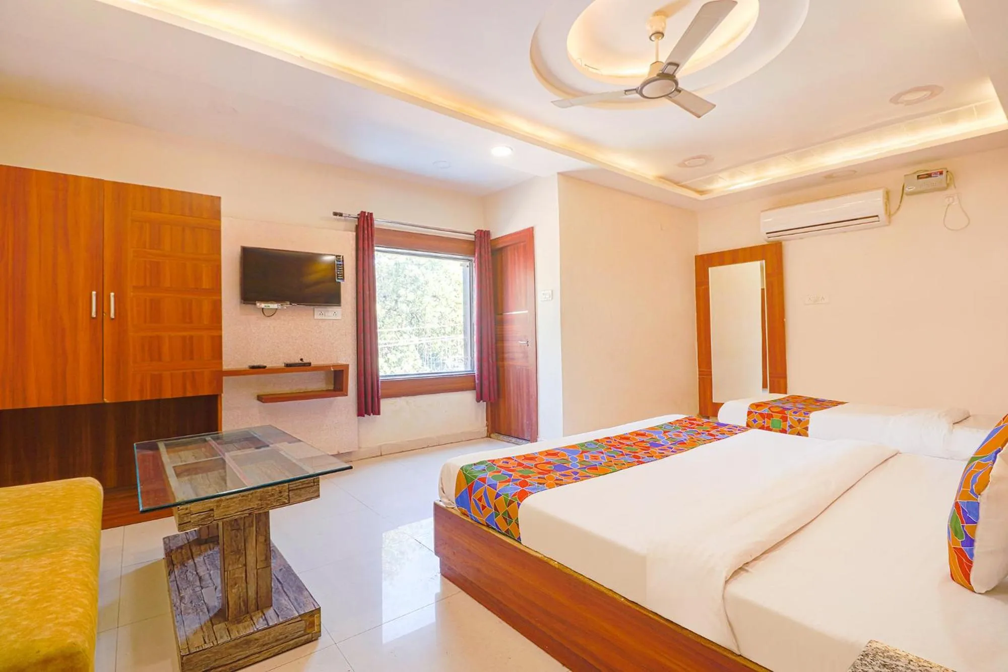 Bed in FabHotel Royal Aanandam
