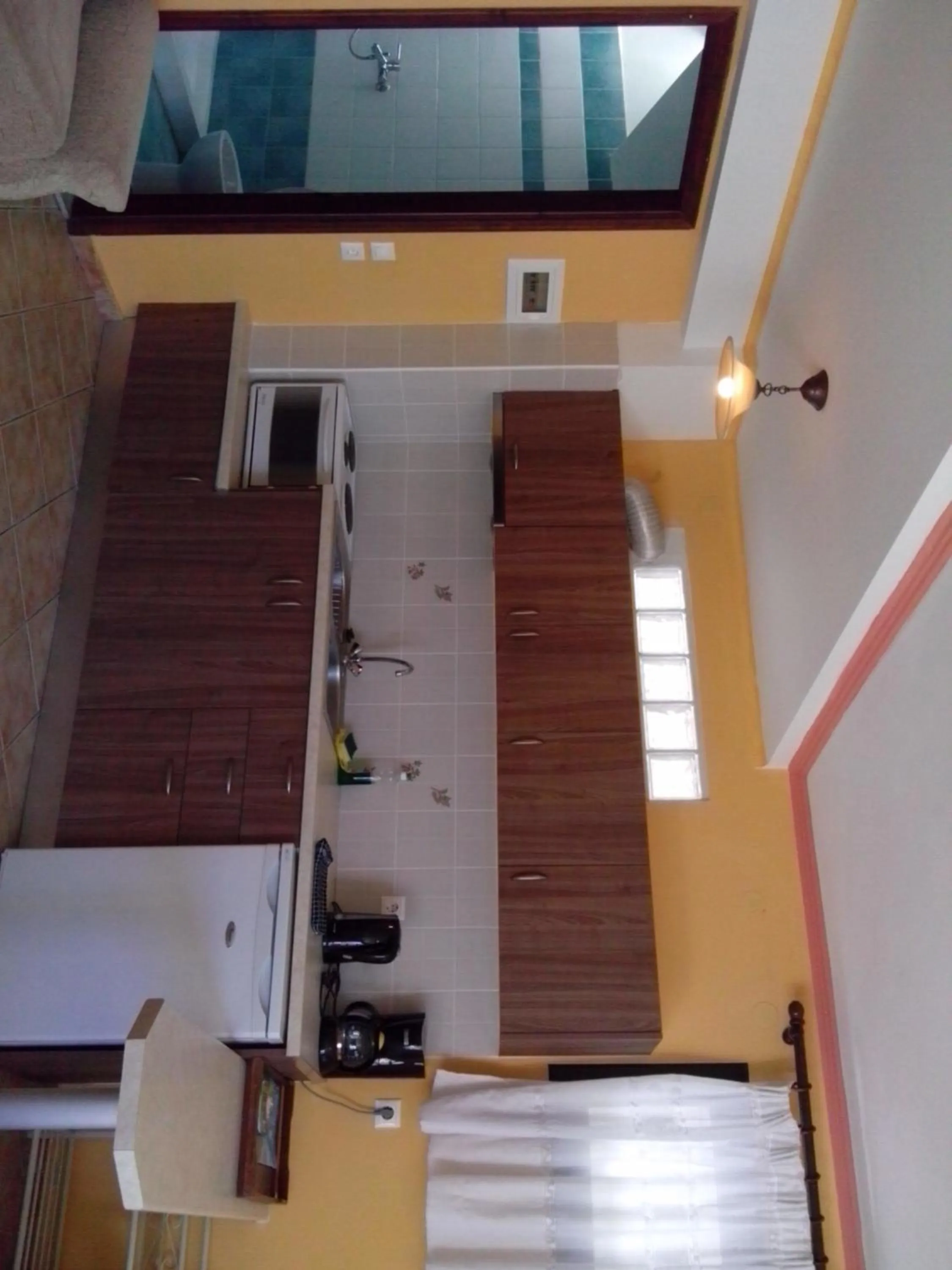 Kitchen or kitchenette in Green Hill Studios & Apartments