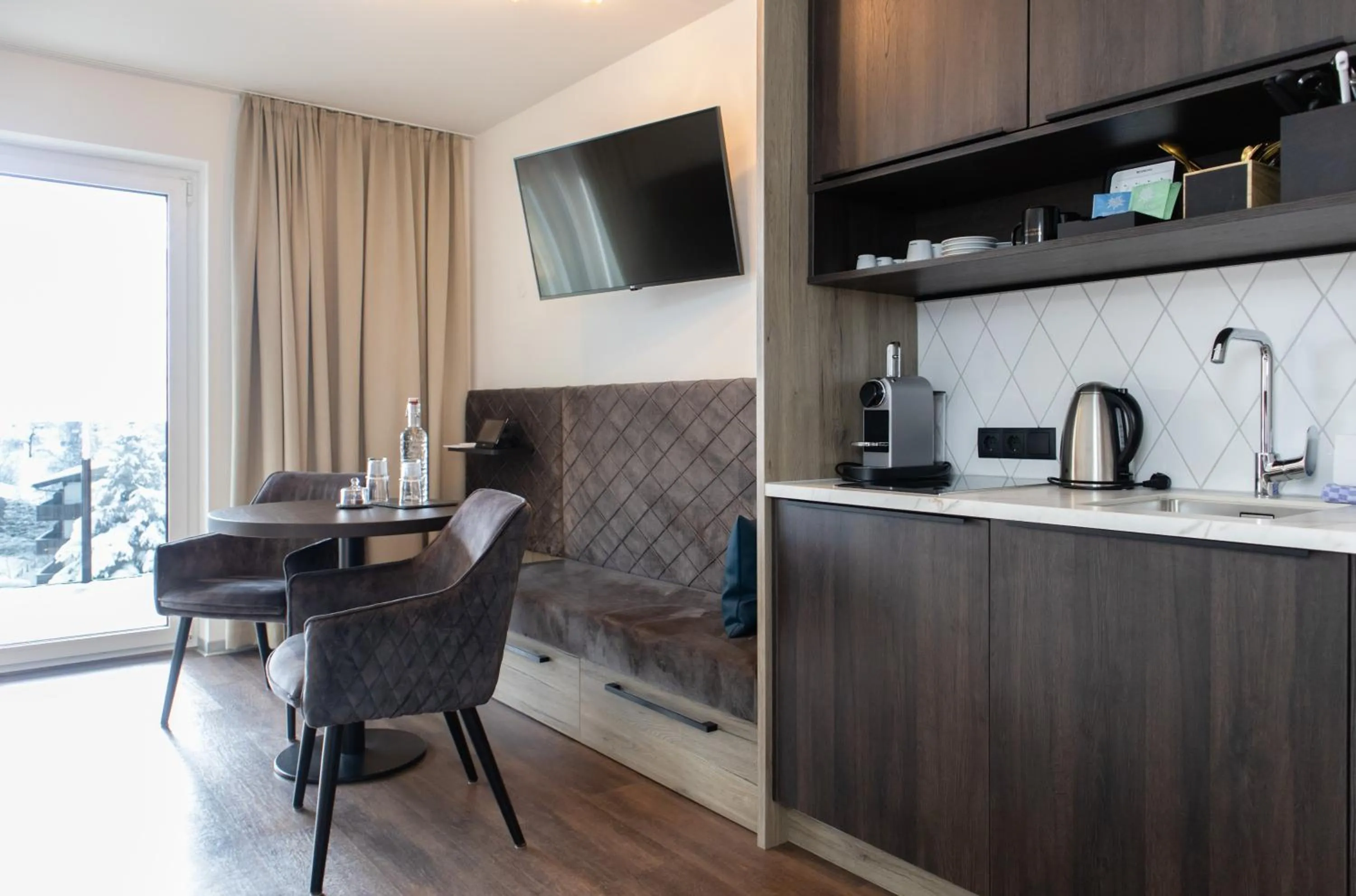 Seating area in GLEMM by AvenidA Superior Hotel & Residences