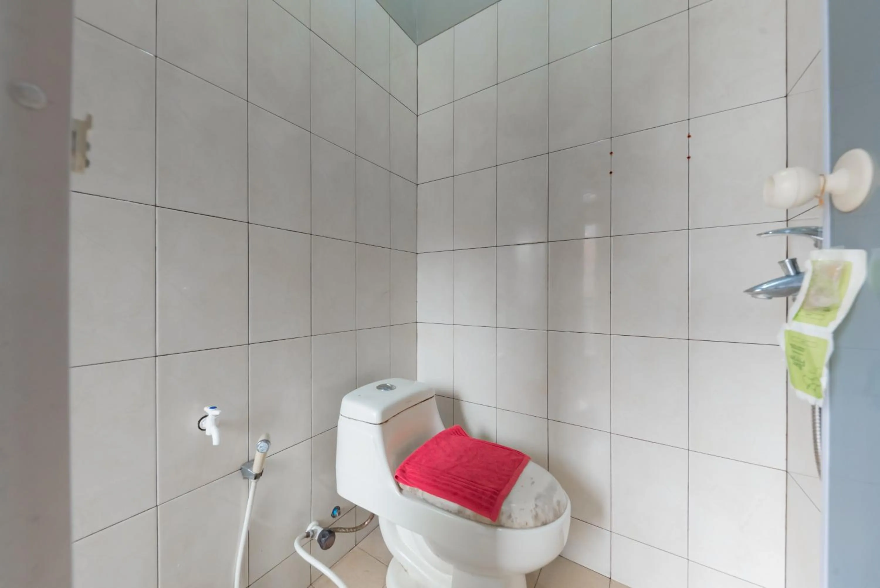 Bathroom in RedDoorz Syariah near Politeknik Negeri Bandung Campus