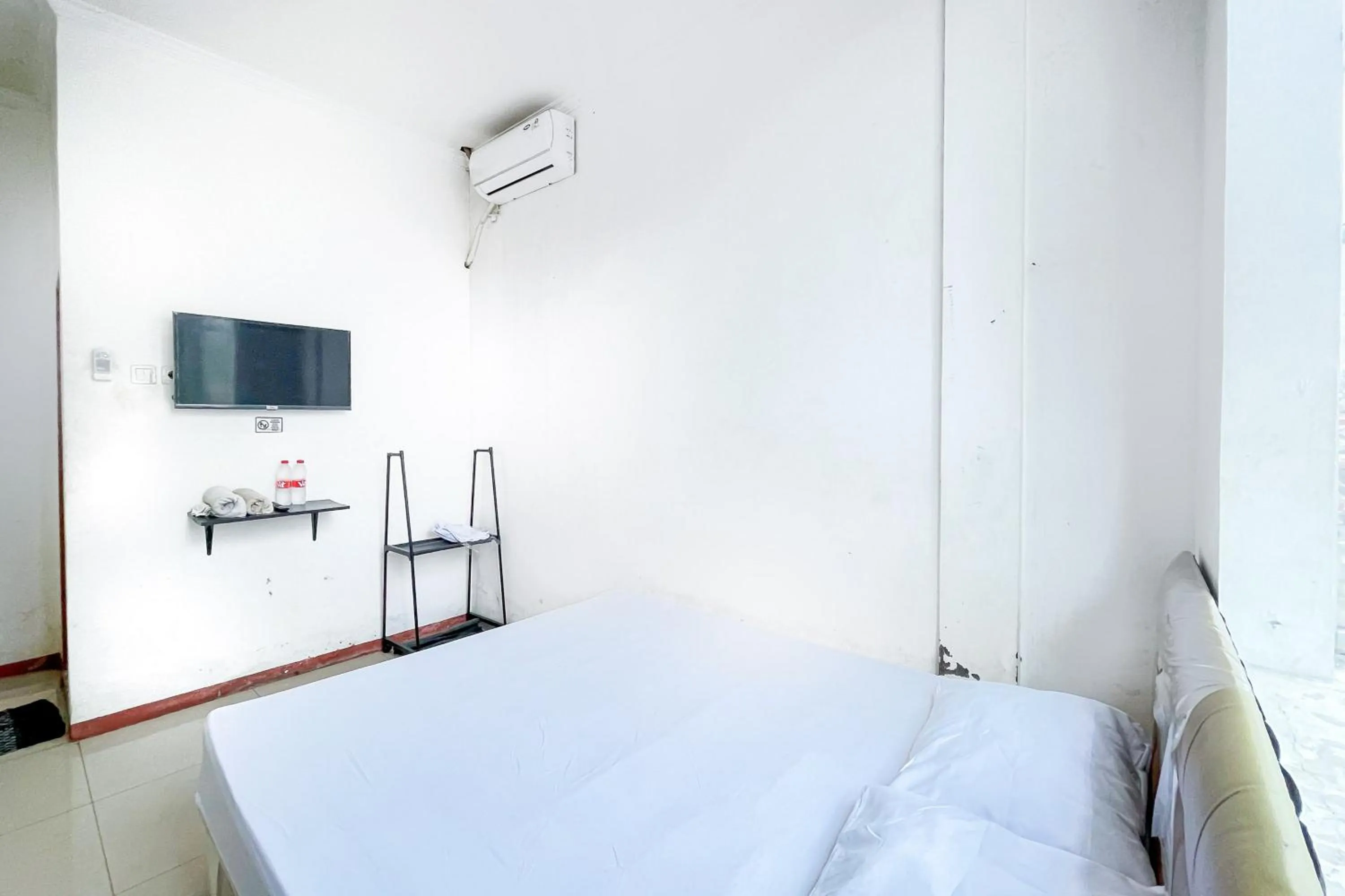 Bed in Citara Jaya Guesthouse Mitra RedDoorz