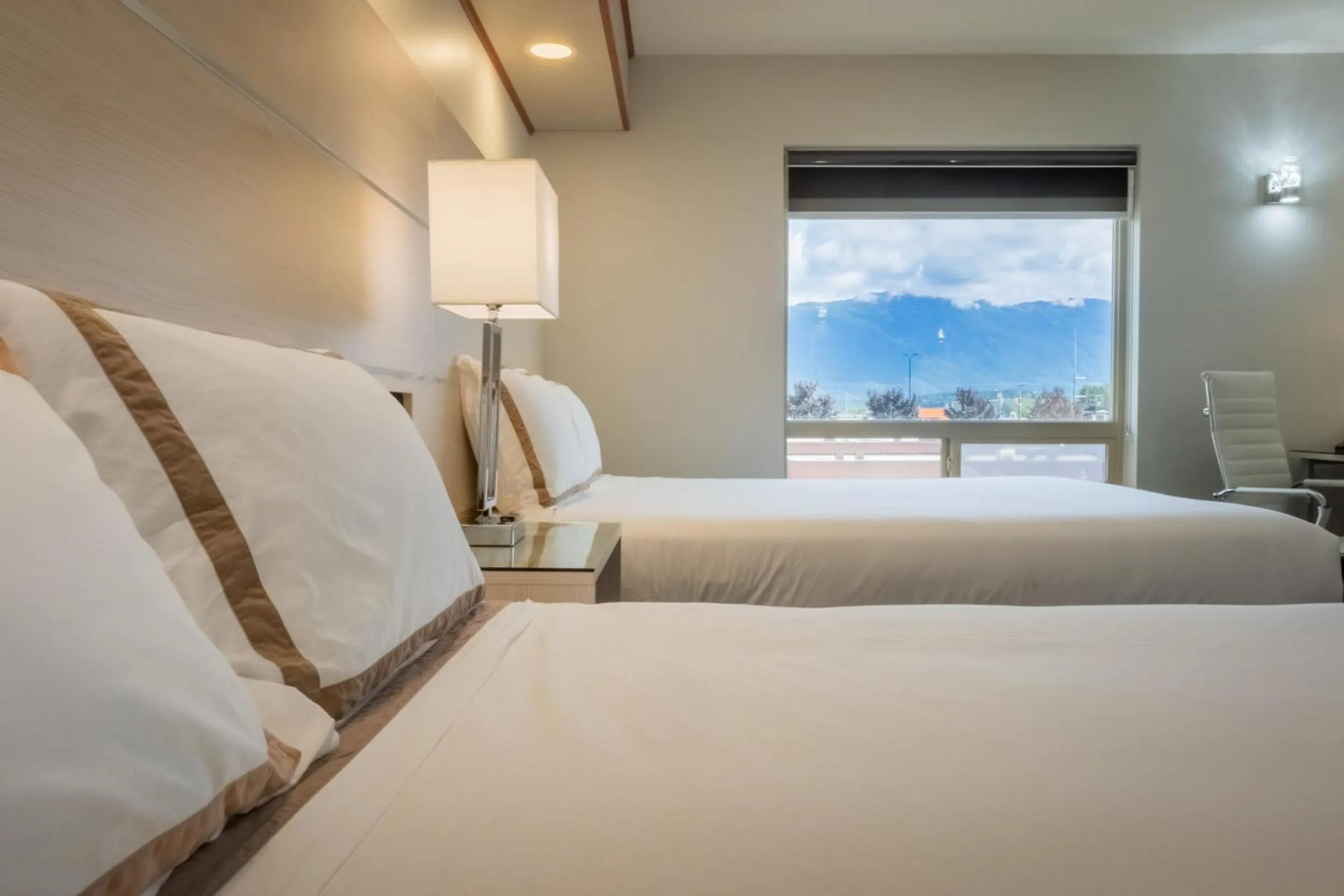 Bed in Quality Inn Sunshine Suites