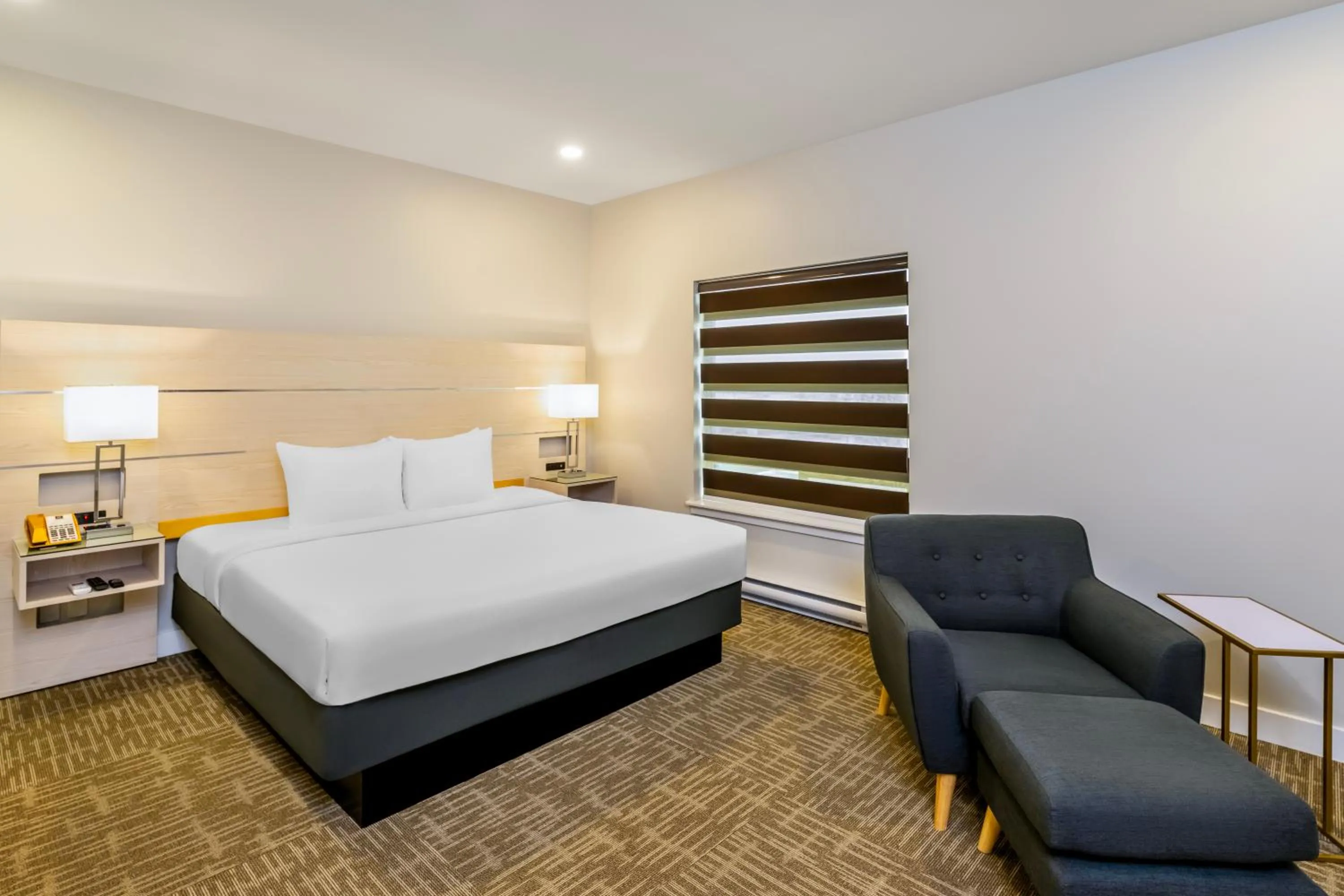 Bed in Quality Inn Sunshine Suites