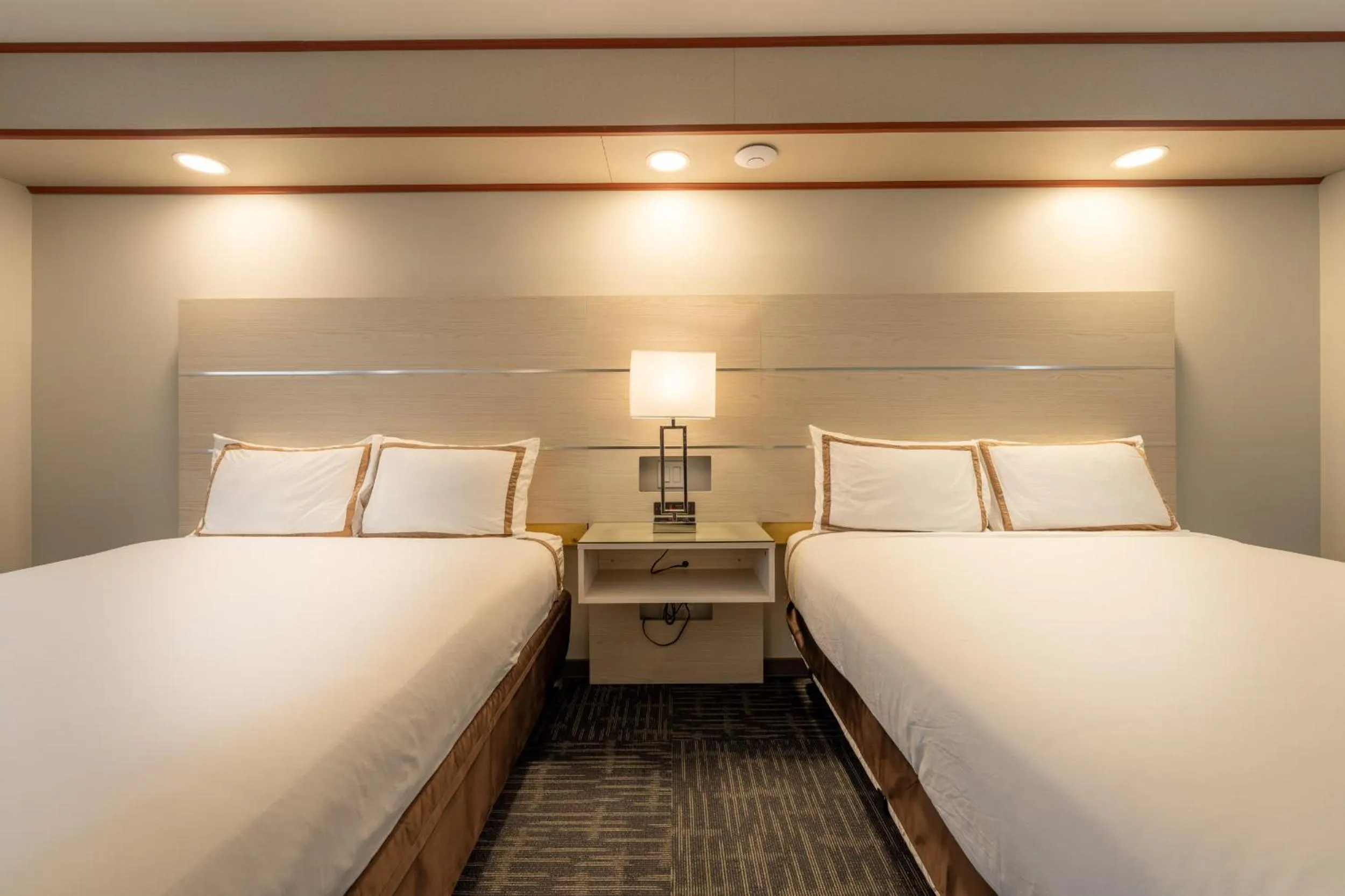 Bed in Quality Inn Sunshine Suites