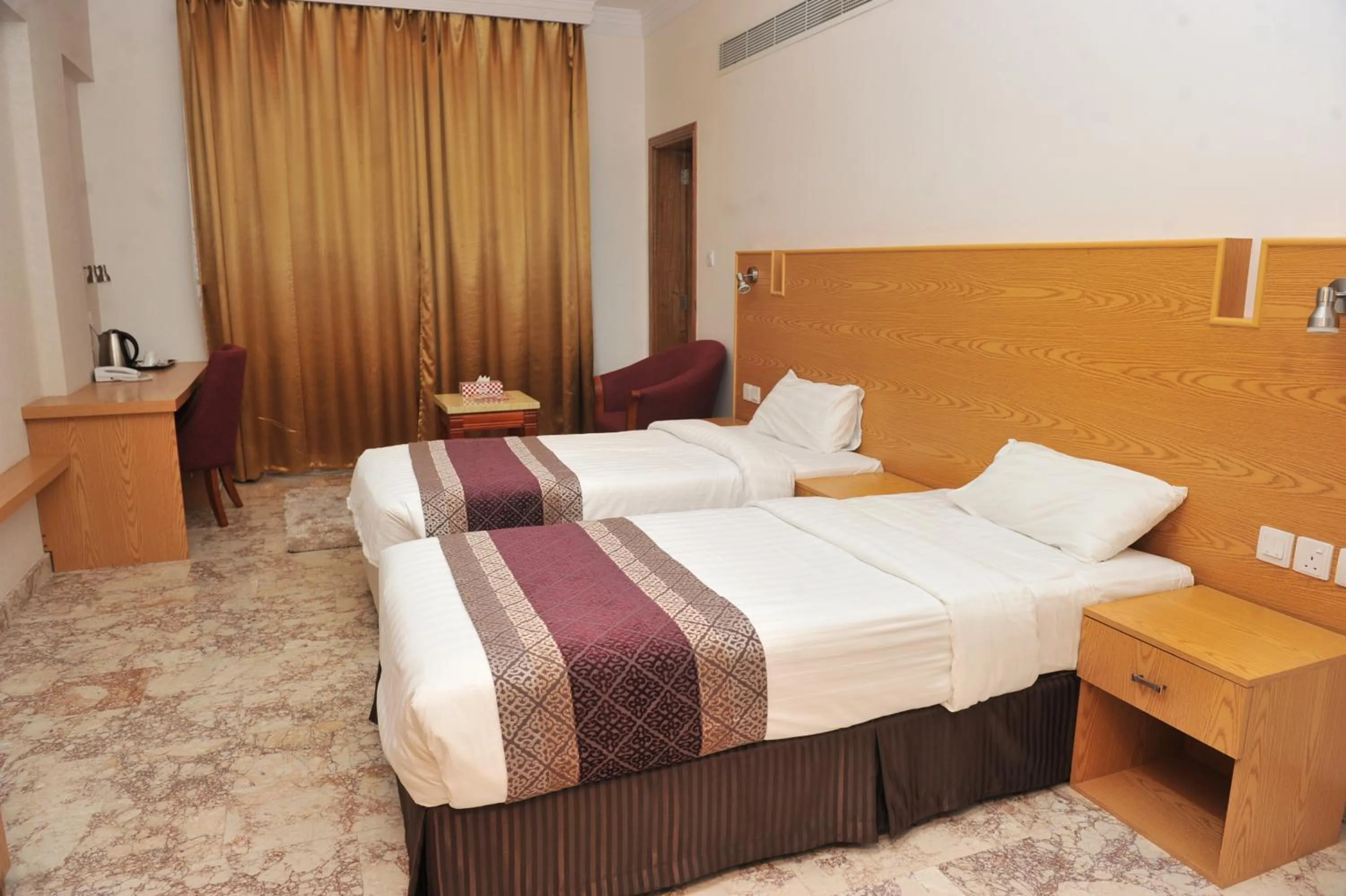 Bed in Al Reef Hotel
