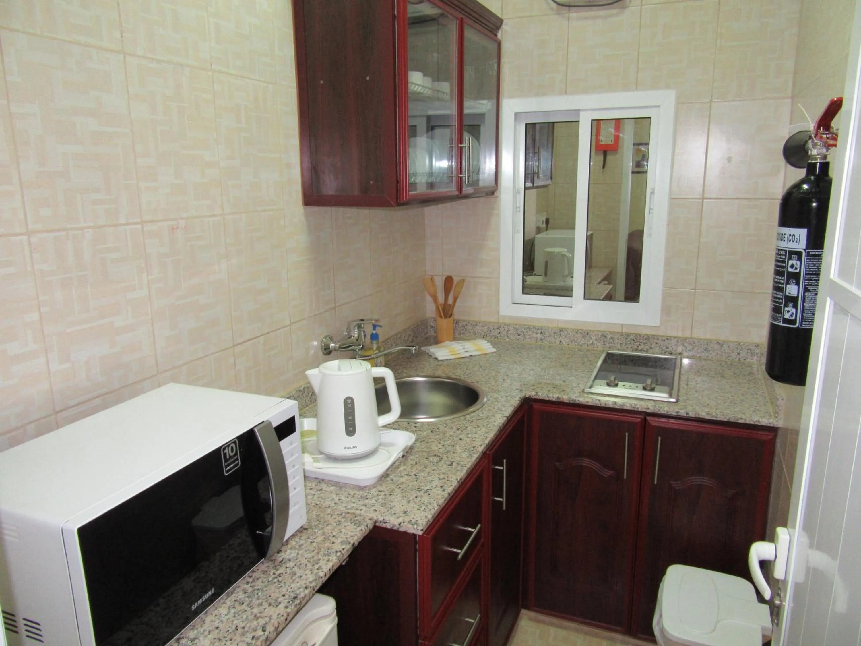 Kitchen or kitchenette in Al Ferdous Hotel Apartments