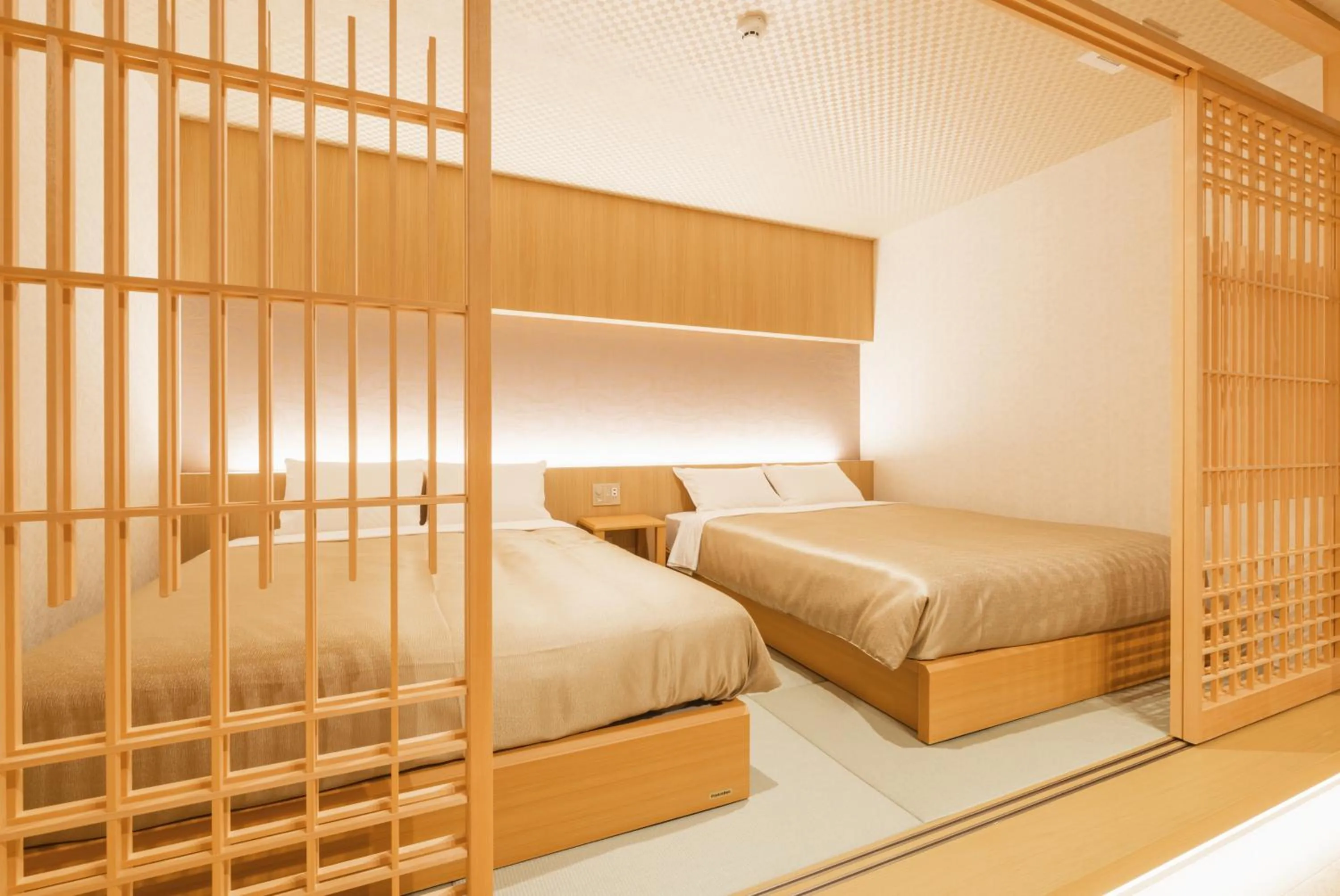 Bed in GRAND BASE Hakata Gofuku
