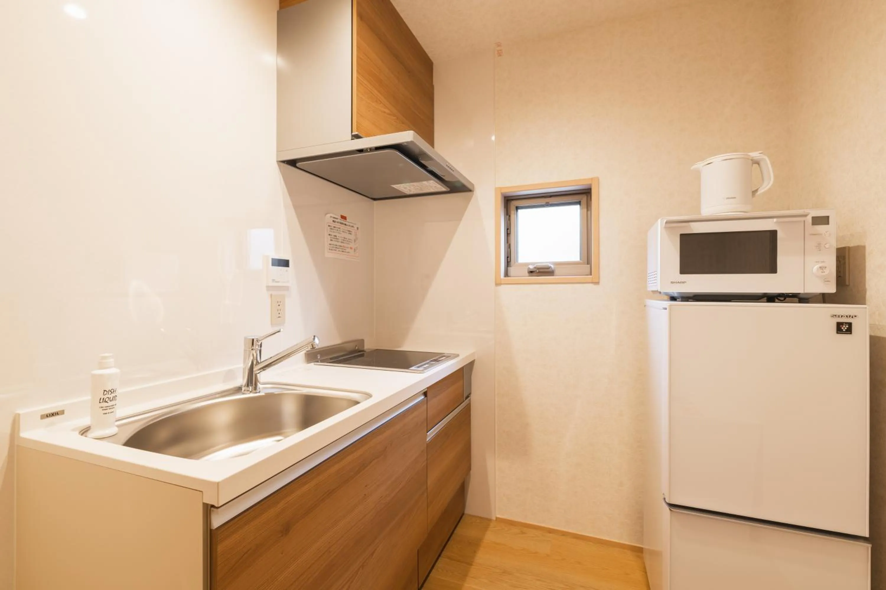 Kitchen or kitchenette in GRAND BASE Hakata Gofuku