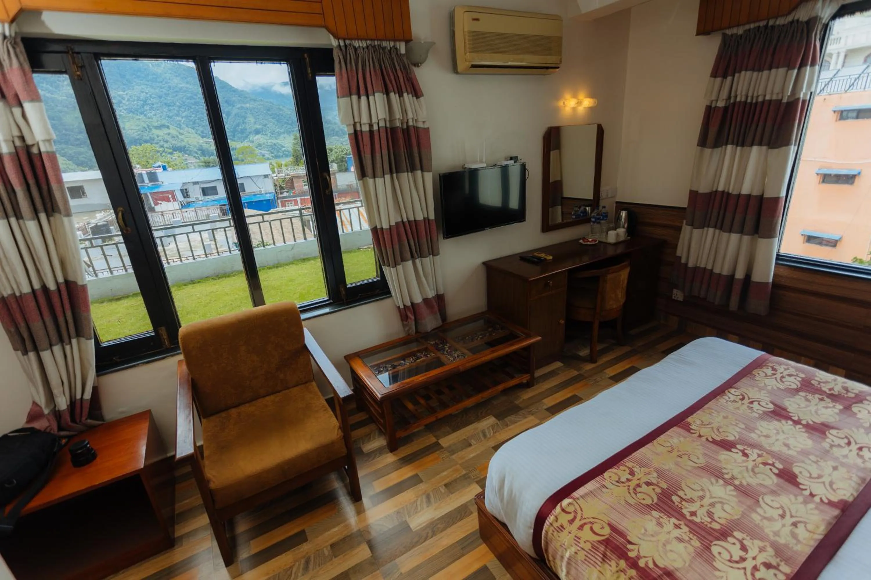 Seating area, Bed in Hotel Tulsi