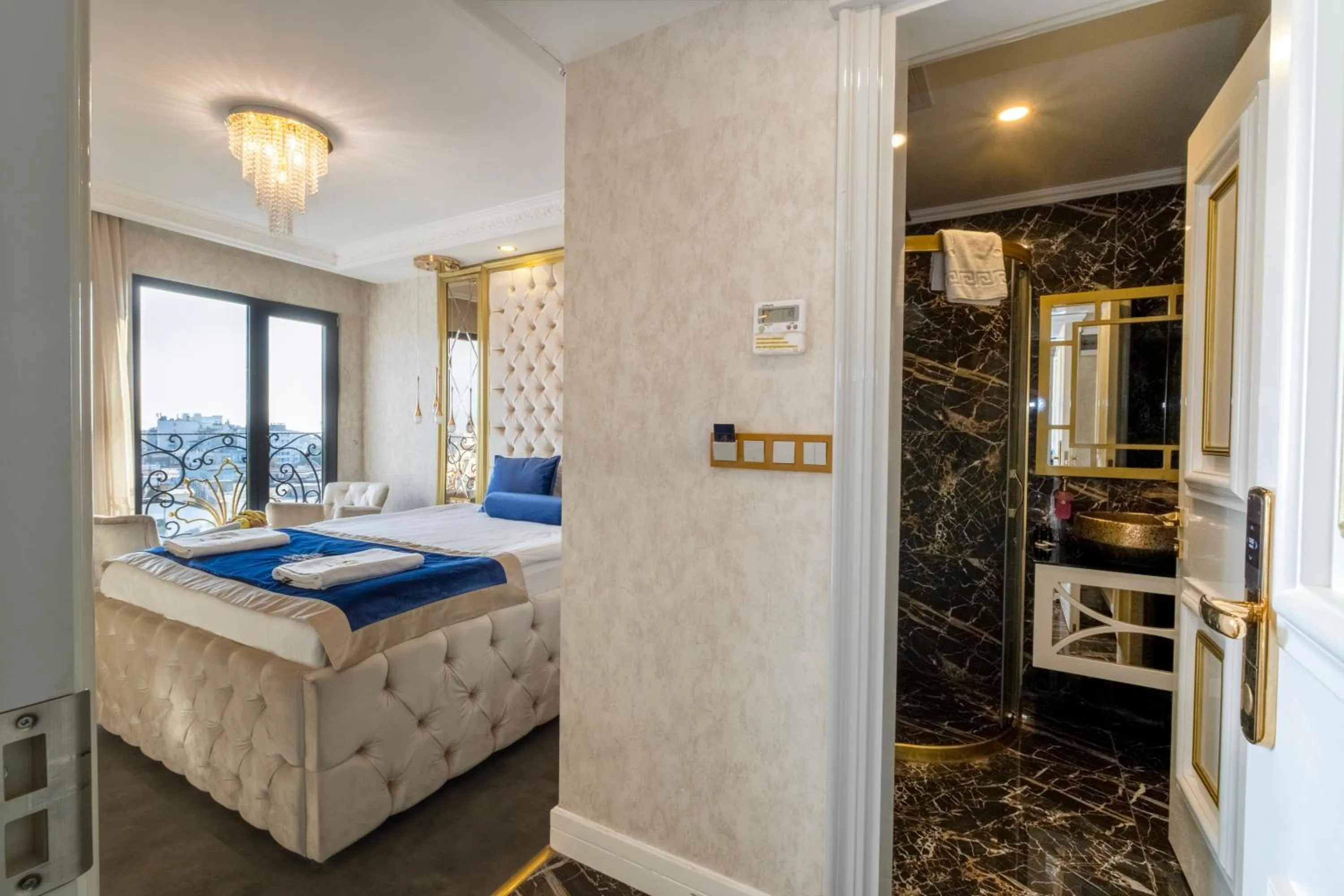 Bed in Leslion Luxury Hotel