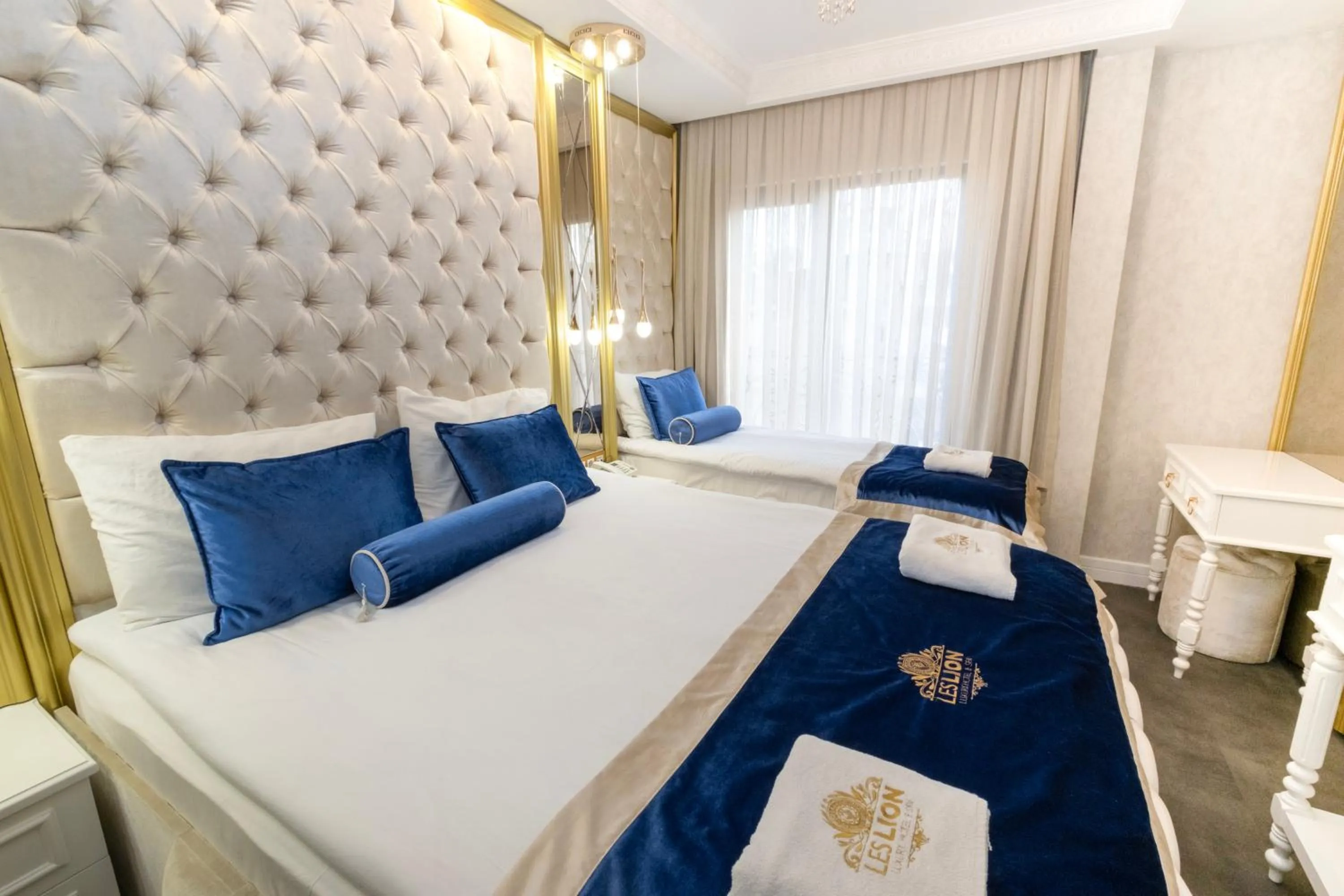 Bed in Leslion Luxury Hotel