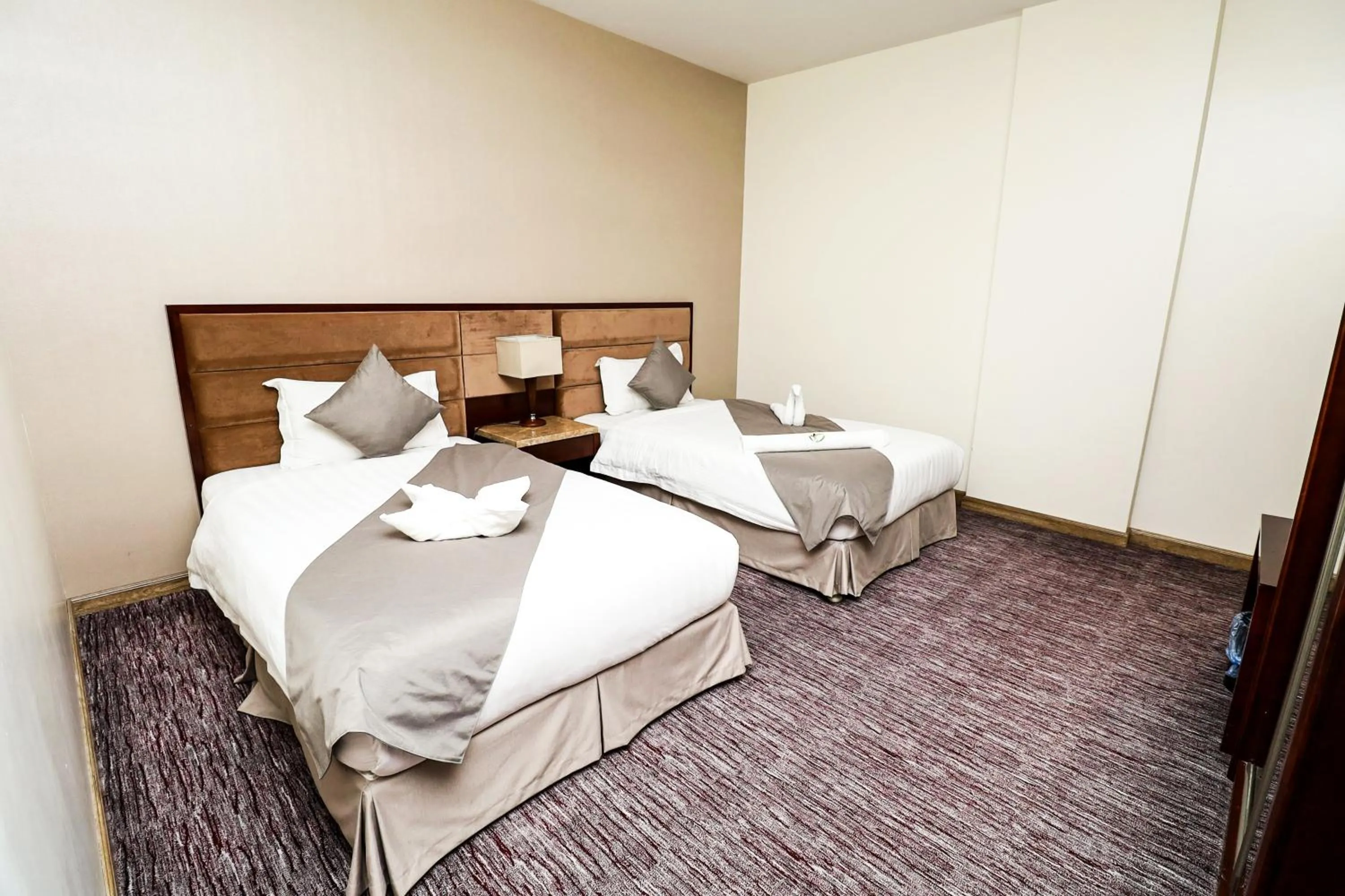 Bed in شقق مسكن المدينة للشقق المخدومة