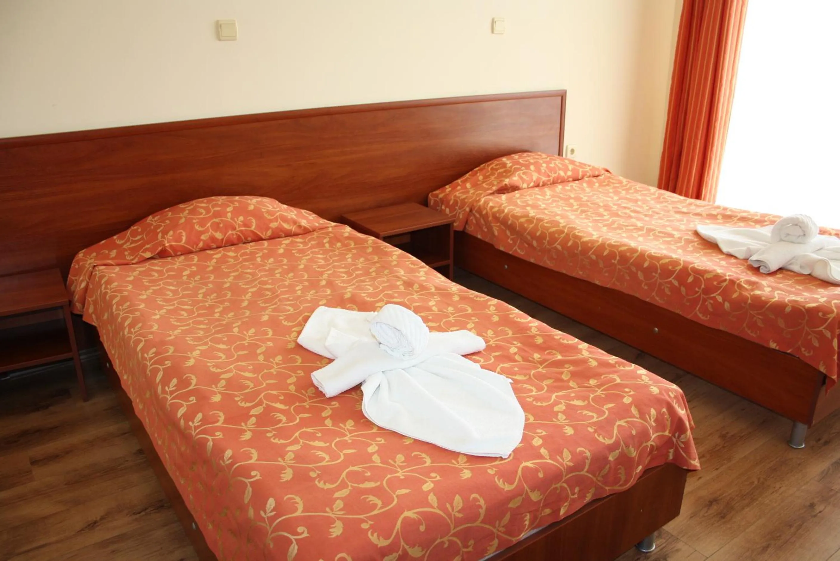 Bed in Iris Beach Hotel