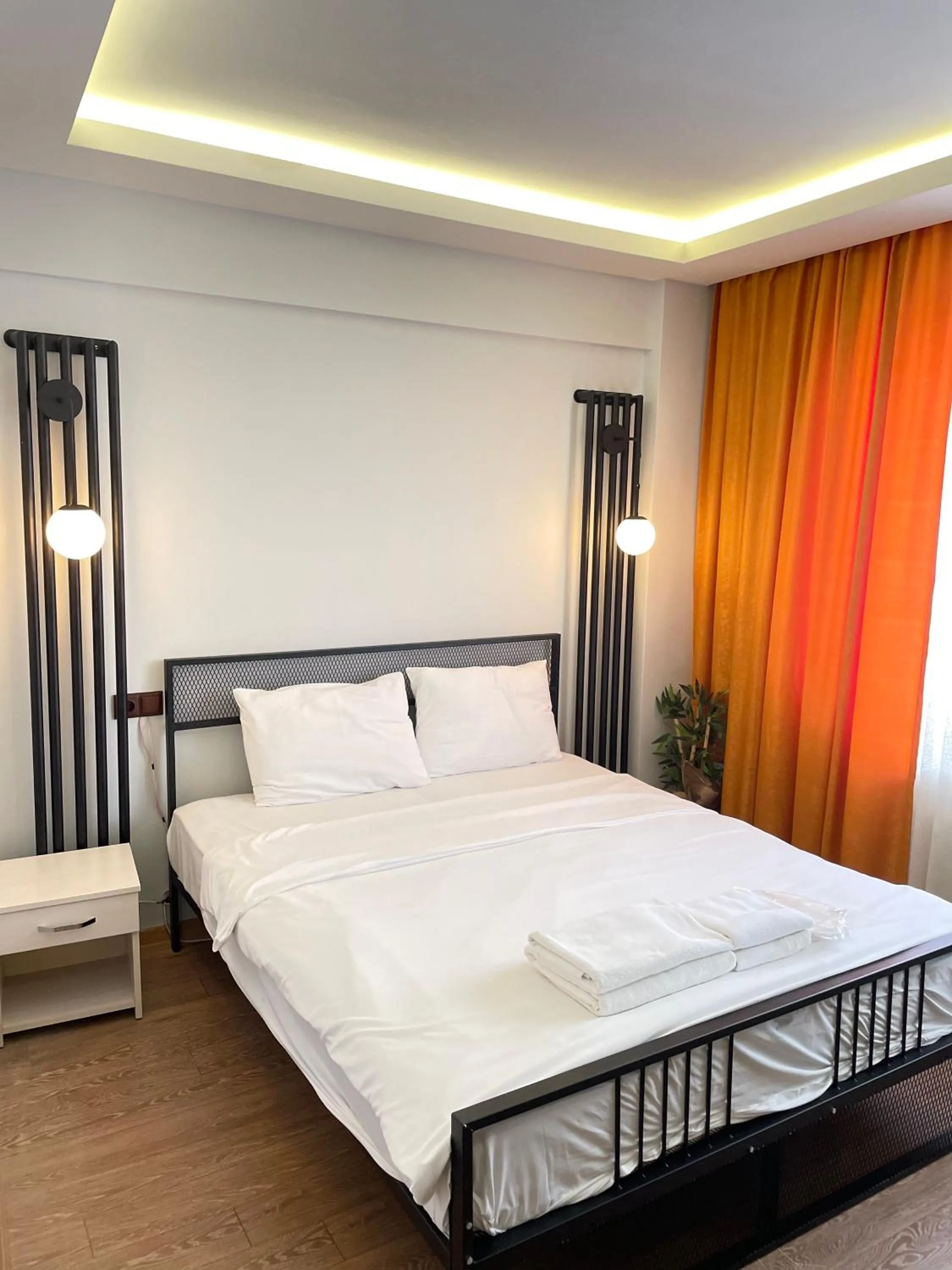 Bed in Ora Bella Hotel