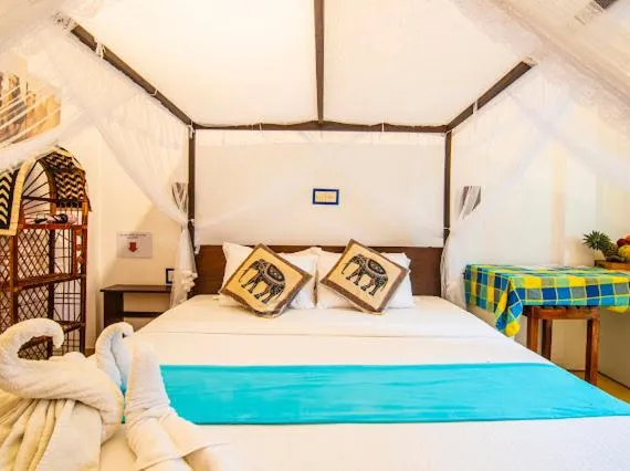 Bed in Frangipani Beach Villa