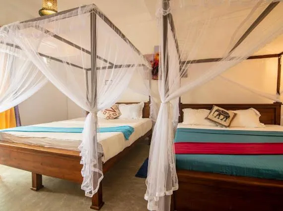 Bed in Frangipani Beach Villa