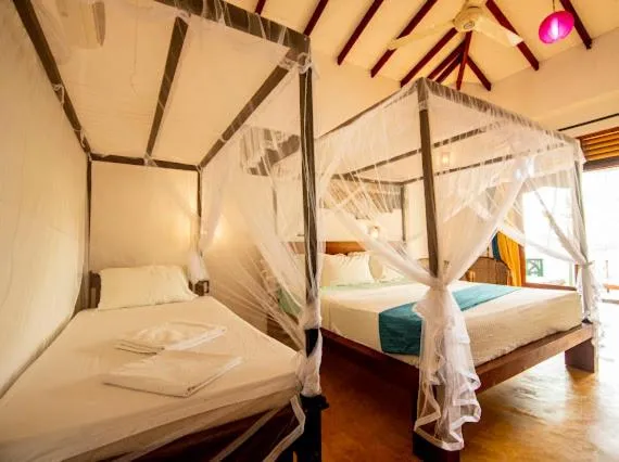 Bed in Frangipani Beach Villa