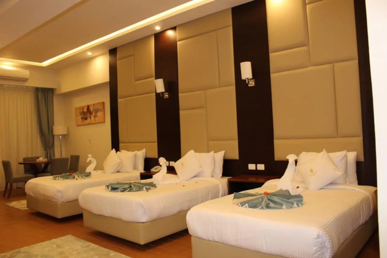 Bed in Royal Jewel Al Raml Hotel